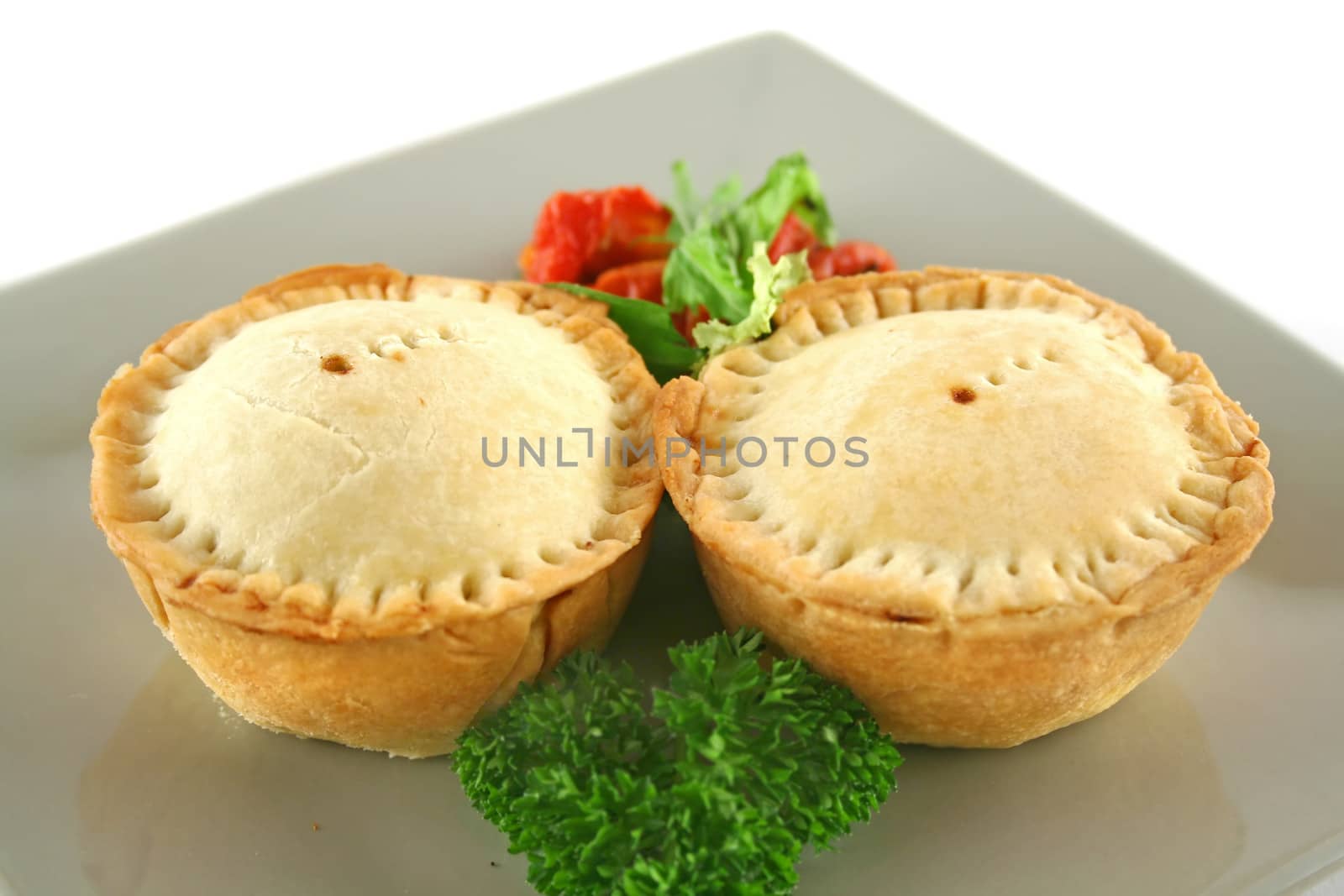 Fresh baked homemade beef pies with sundried tomato salad.