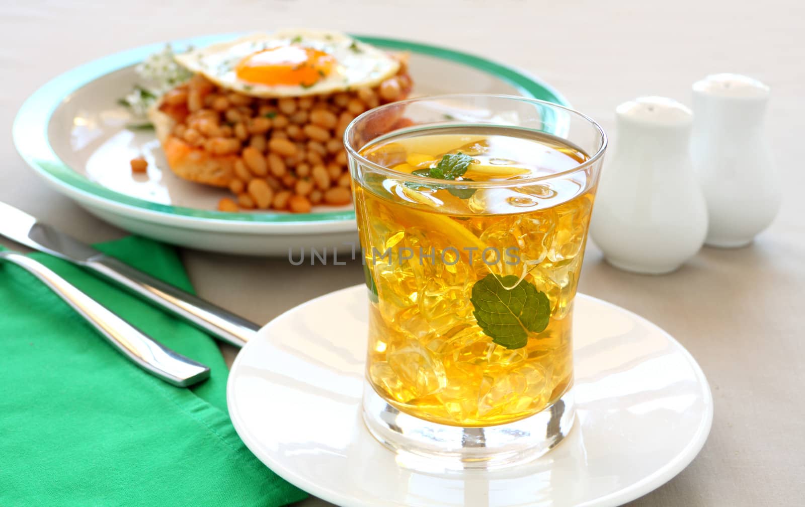 Delightful mint and lemon iced tea with baked beans for breakfast.