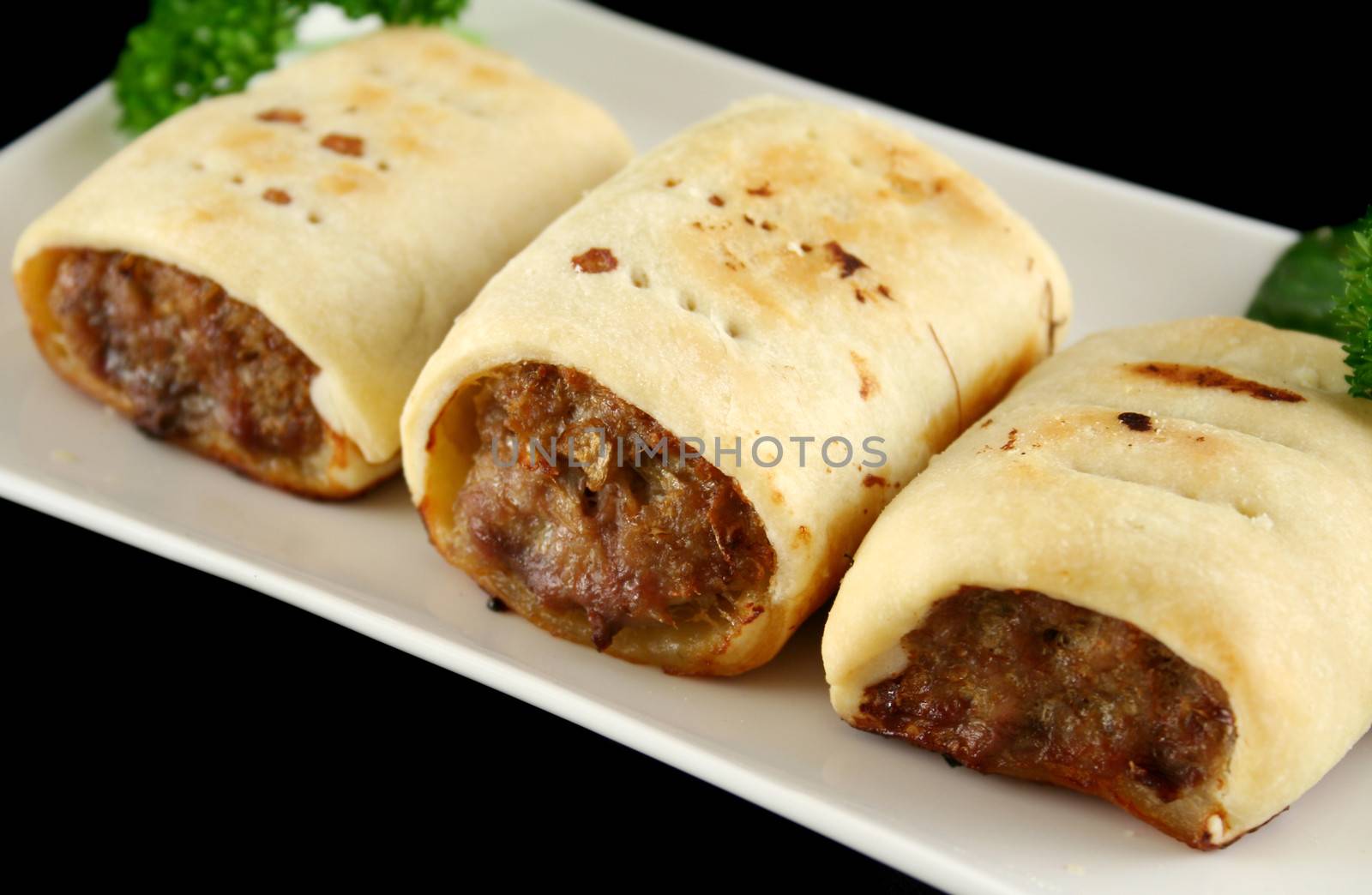 Delicious fresh baked homestyle sausage rolls ready to serve.