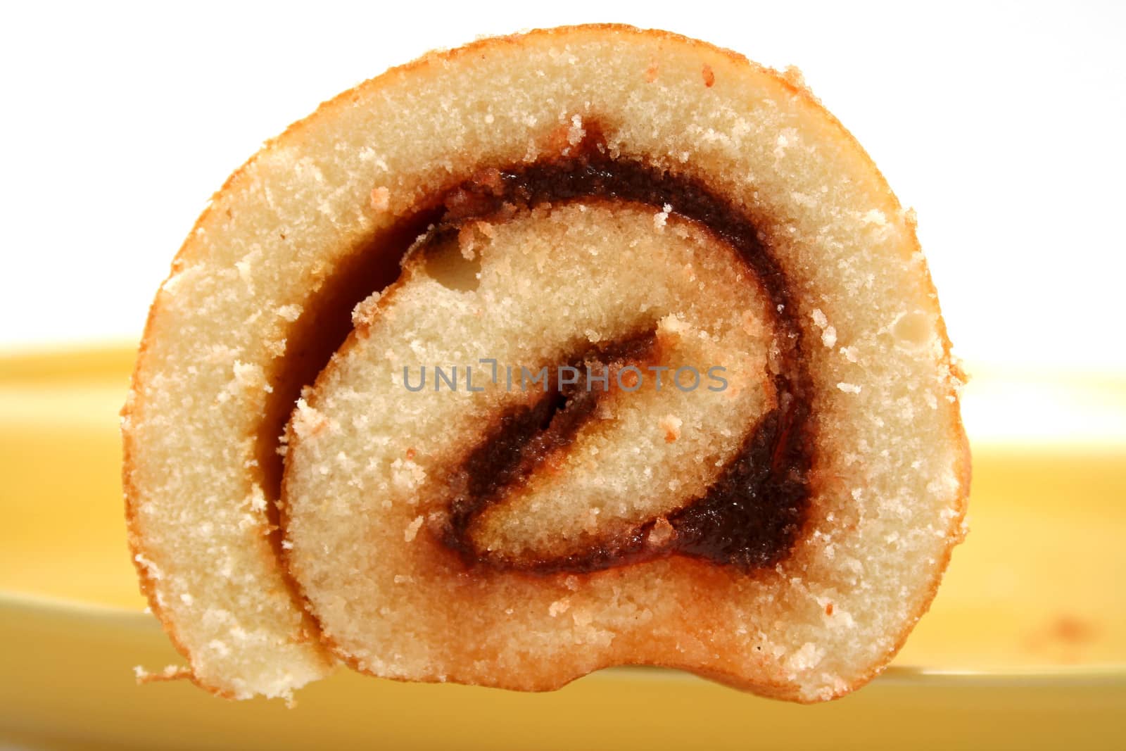 Sliced strawberry jam roll ready to serve.
