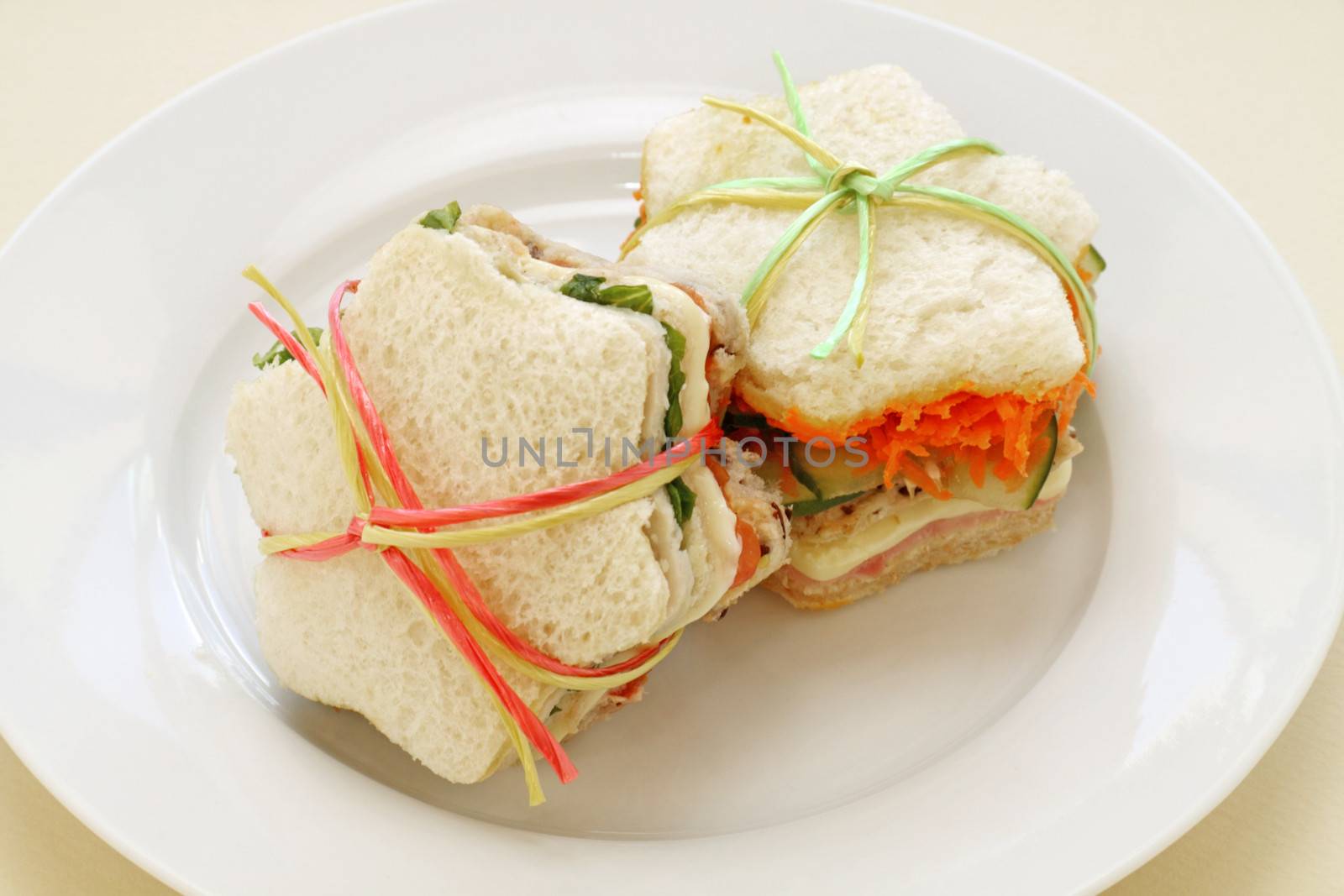Healthy kids sandwiches cut in the shape of a star and tied up.