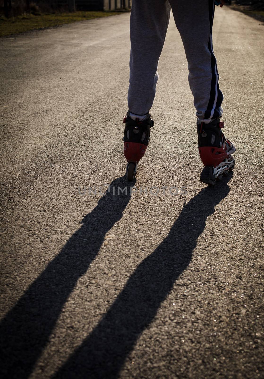 roller skating on the road, close up legs