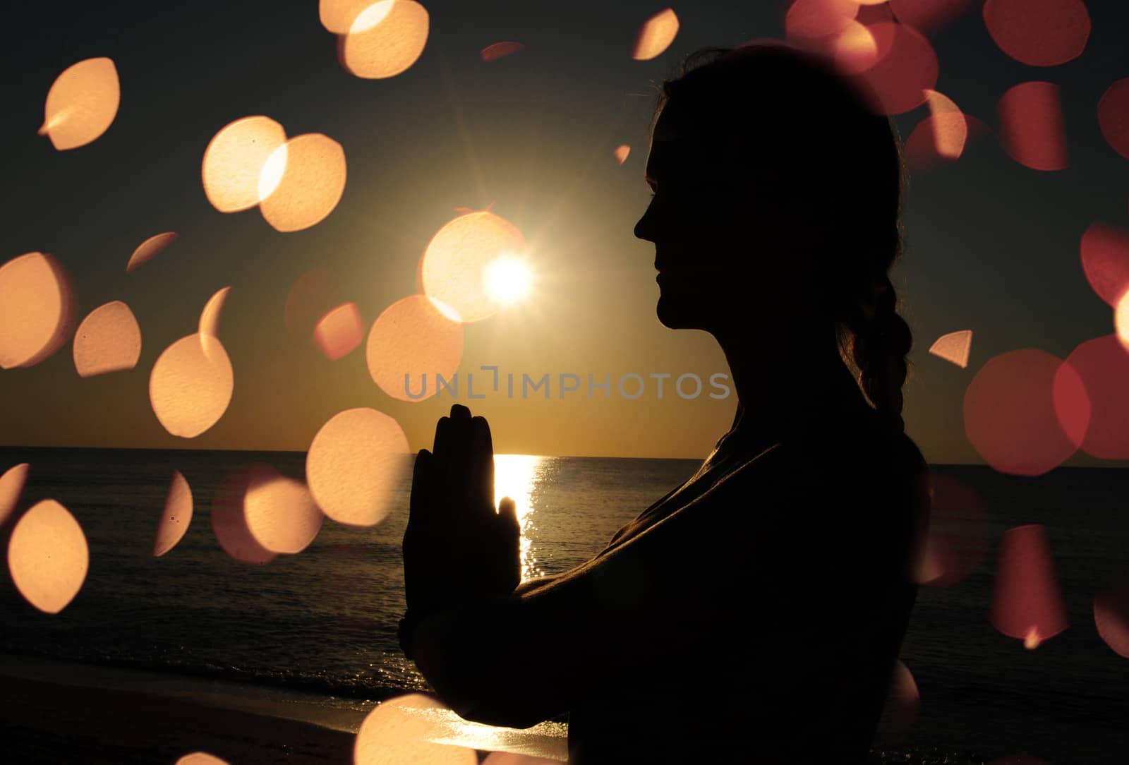 woman praying or meditating by ftlaudgirl