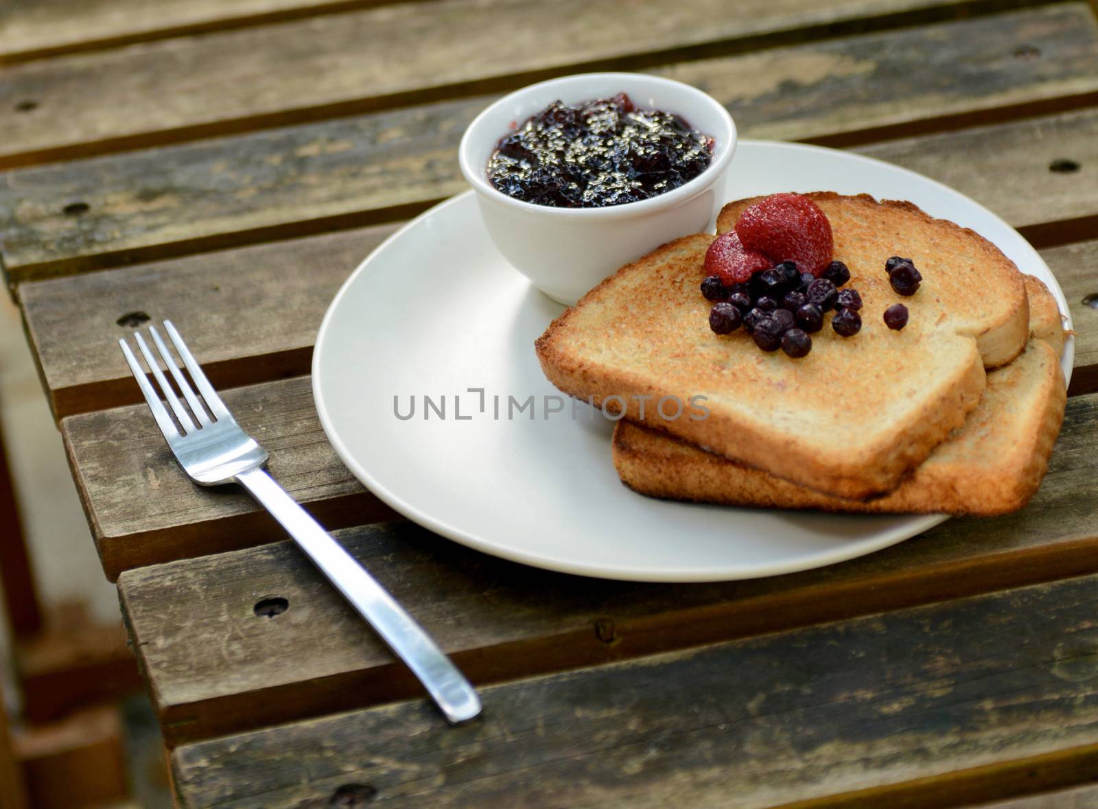 toast with berries and jam for breakfast