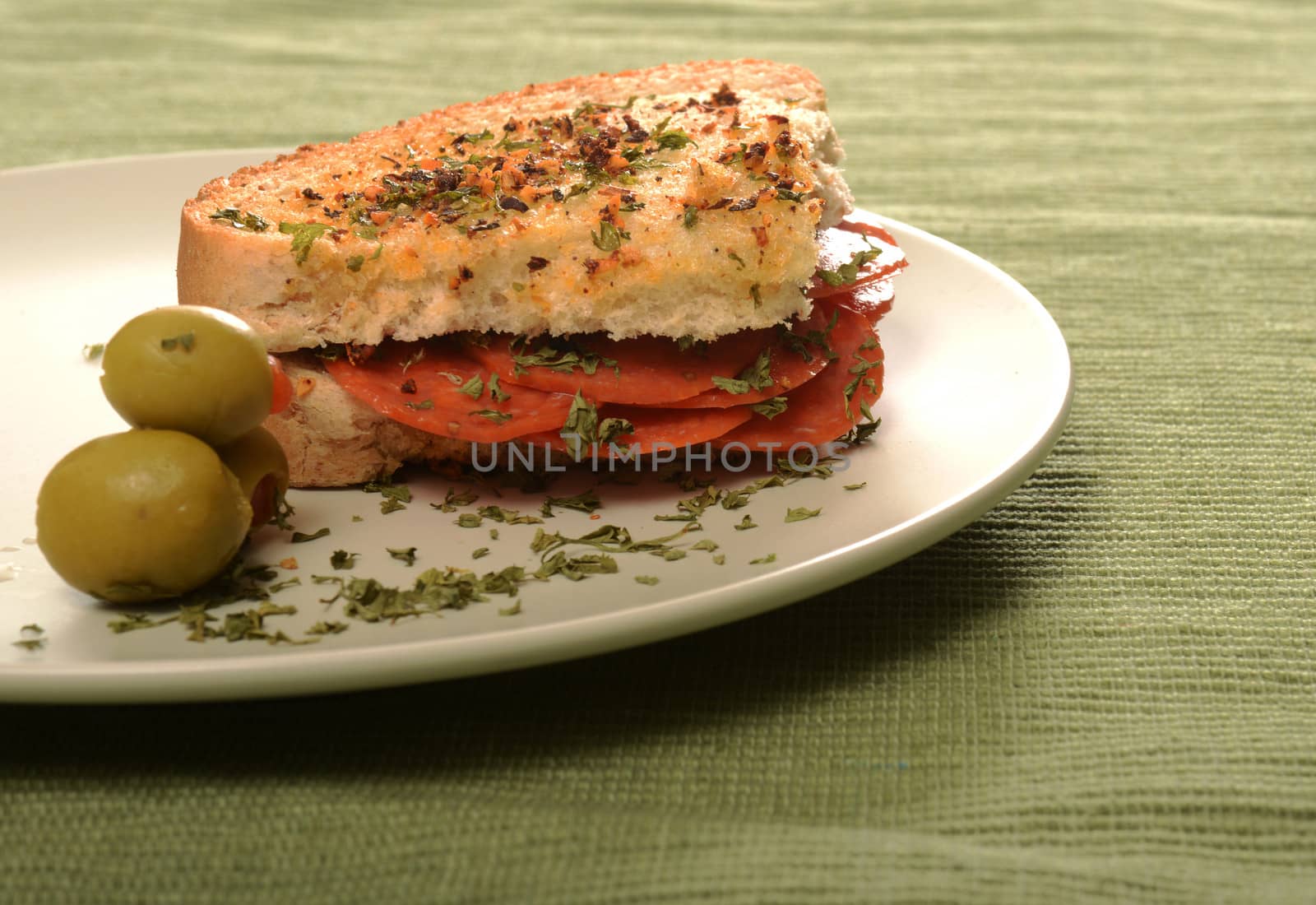 Italian sandwich with toasted herb bread with salami or pepperoni 