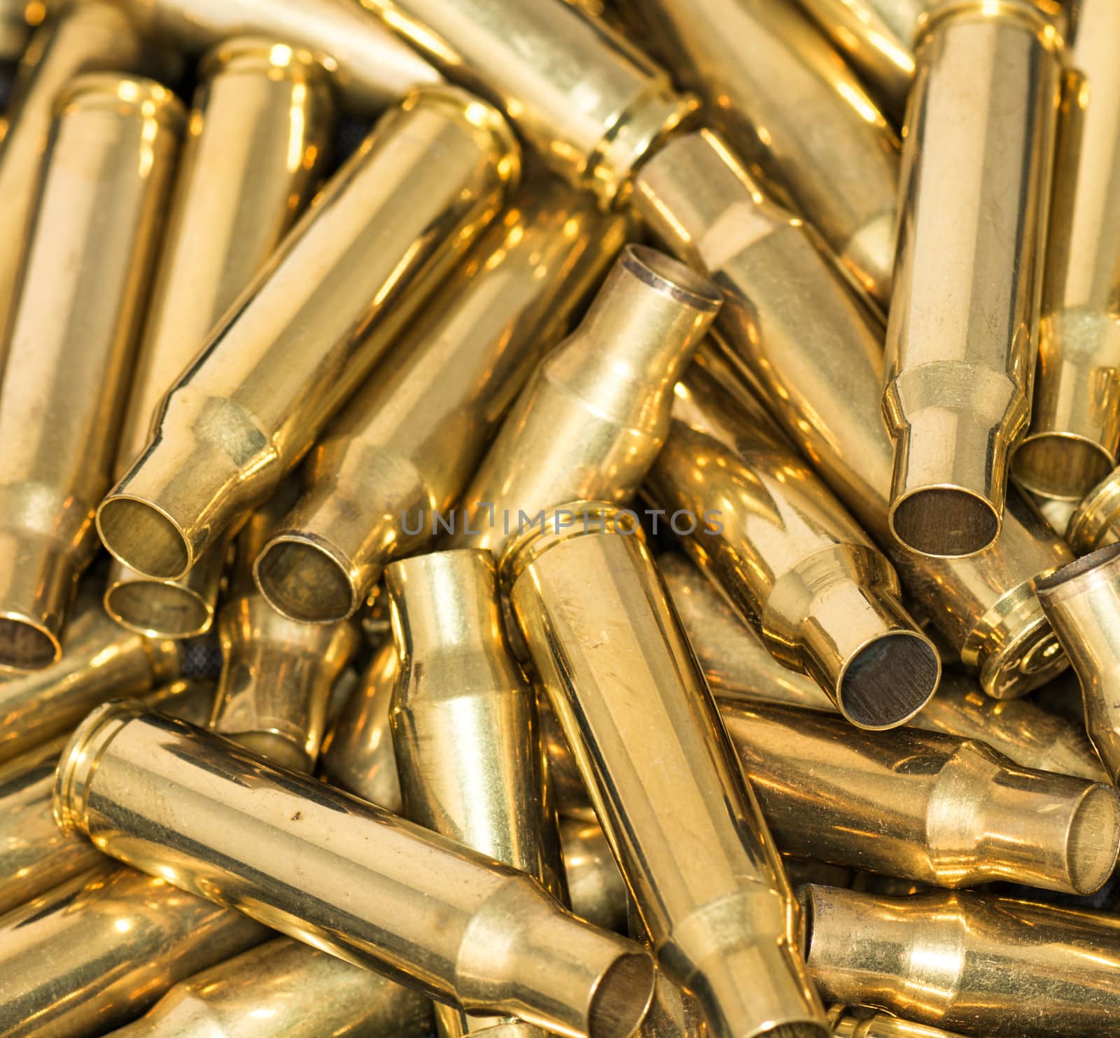 Pile of empty bullet shells by IVYPHOTOS