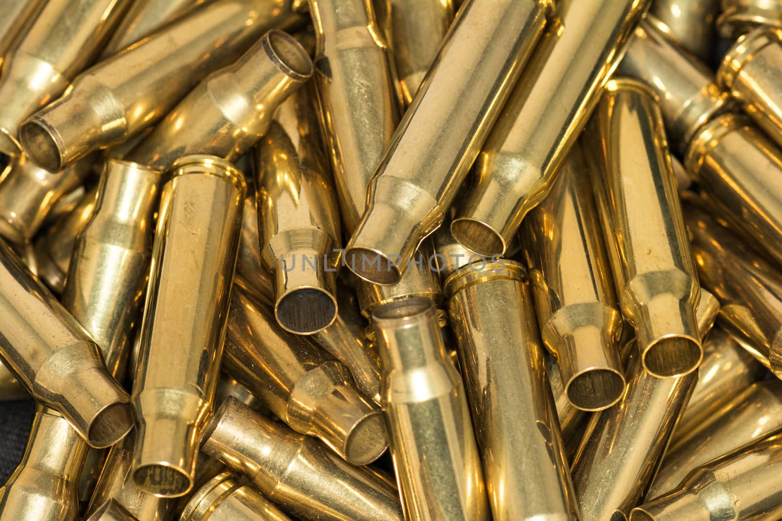 Abstract of pile of empty bullet shells with details