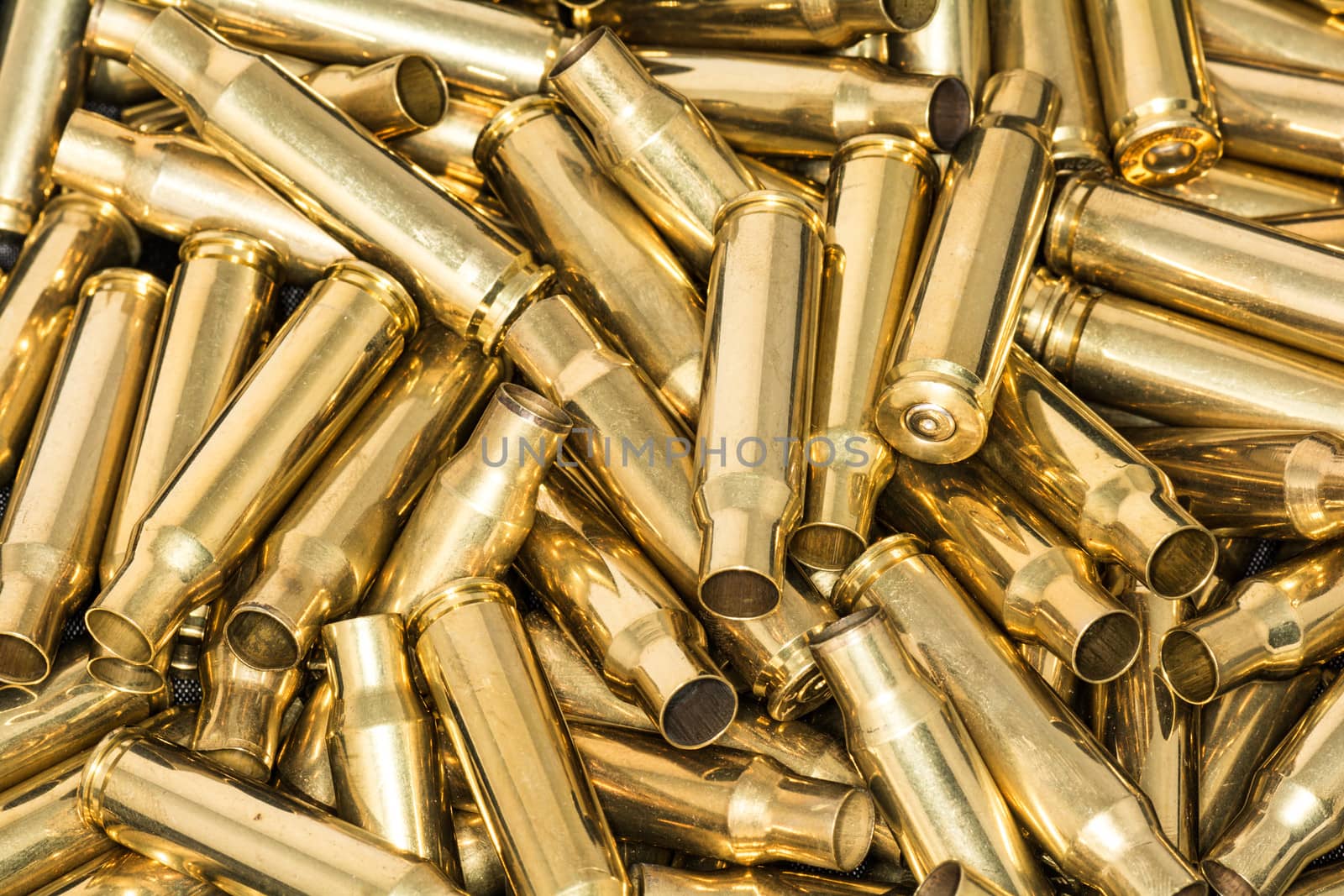 Pile of empty bullet shells by IVYPHOTOS