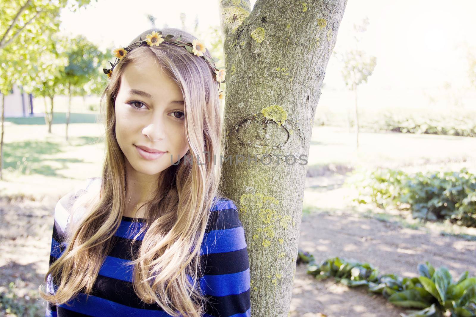 Vintage style shot of a teenager giurl with flowers in her hair