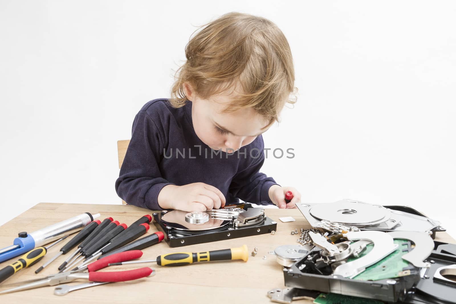 child repairing hard disk drive by gewoldi