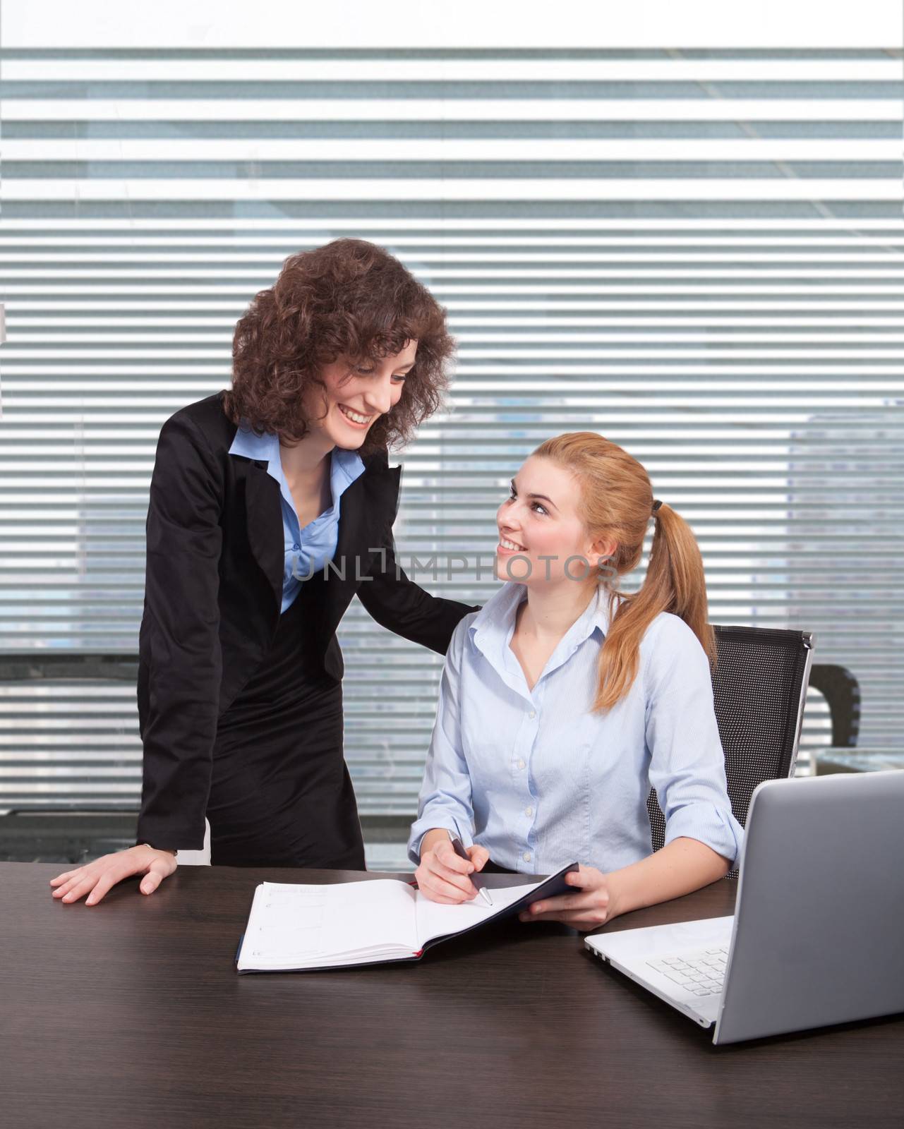 These young businesswomen are meeting in a commercial business lobby