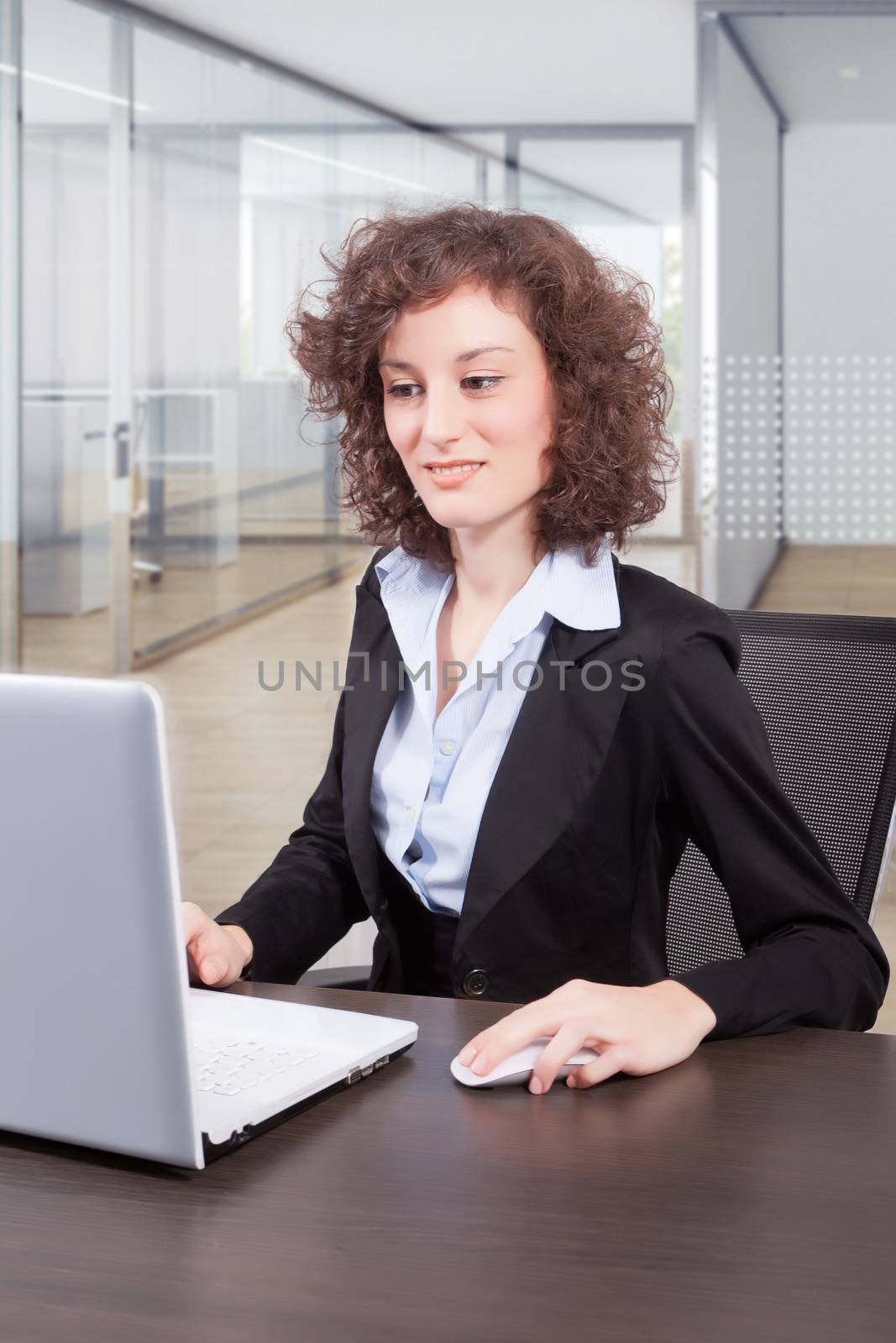 businesswoman in office by matteobragaglio