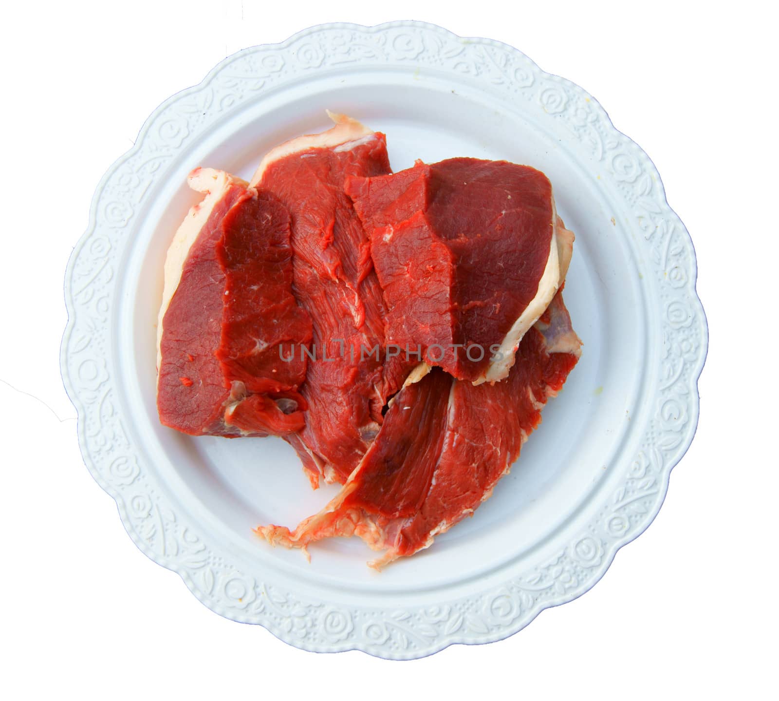 Damp meat on plate on white background