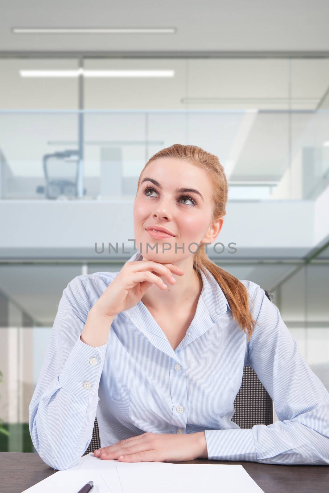 woman at desk think at new idea