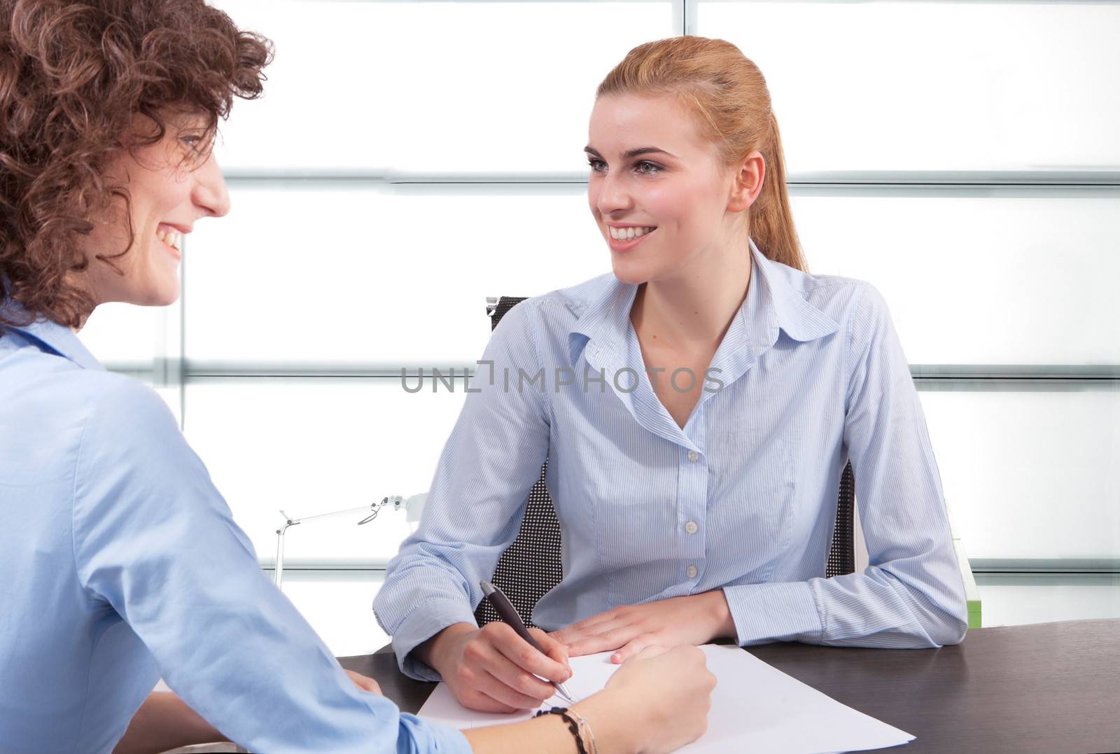 two business woman have a meeting in office