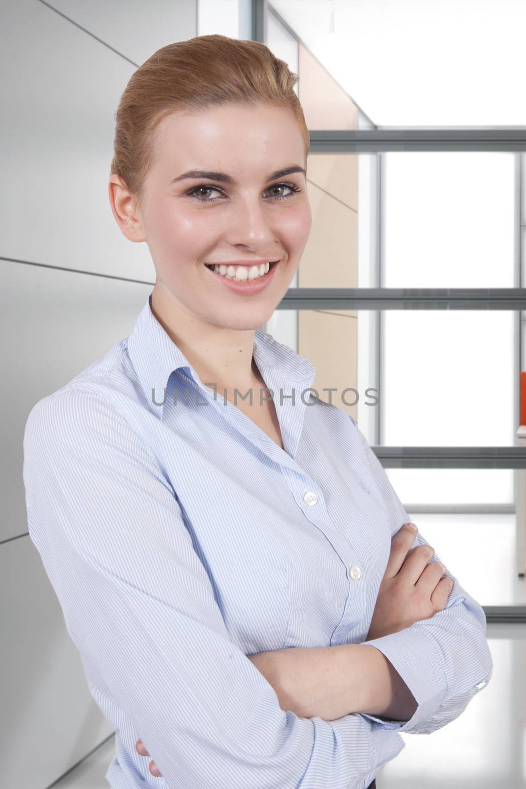 business woman looking at the camera in office