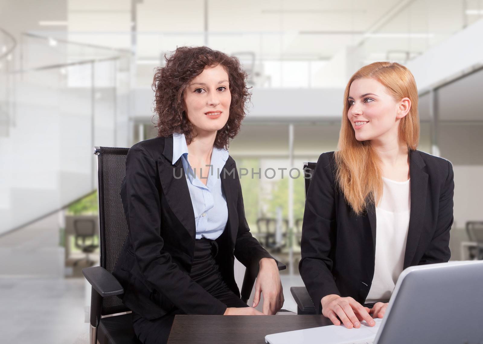 two business woman have a meeting in office