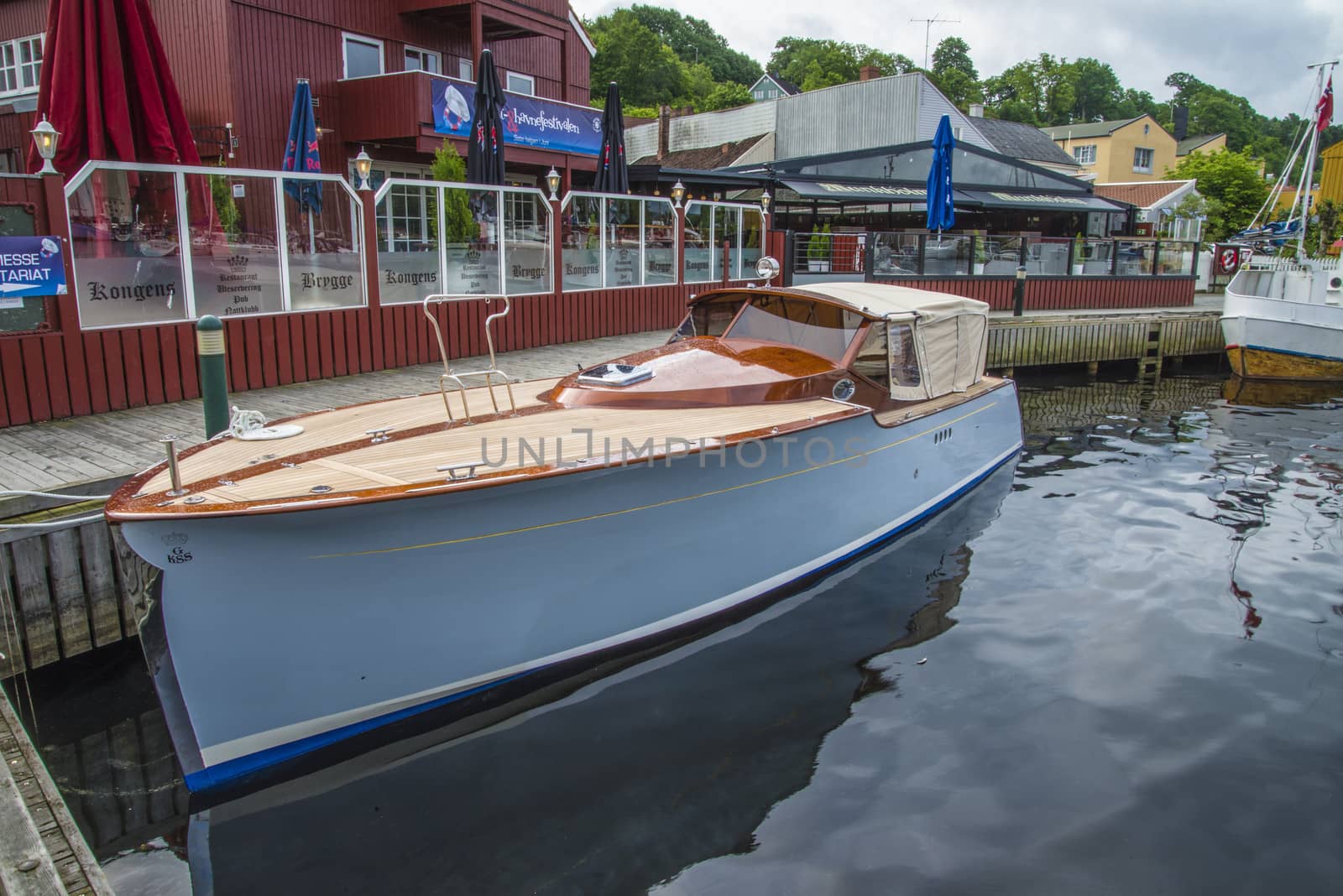 The boat is on display at the harbor during Halden food and harbor festival which is held every year on the last weekend of June. The deck of the boat is built in teak and mahogany. Halden, Norway.