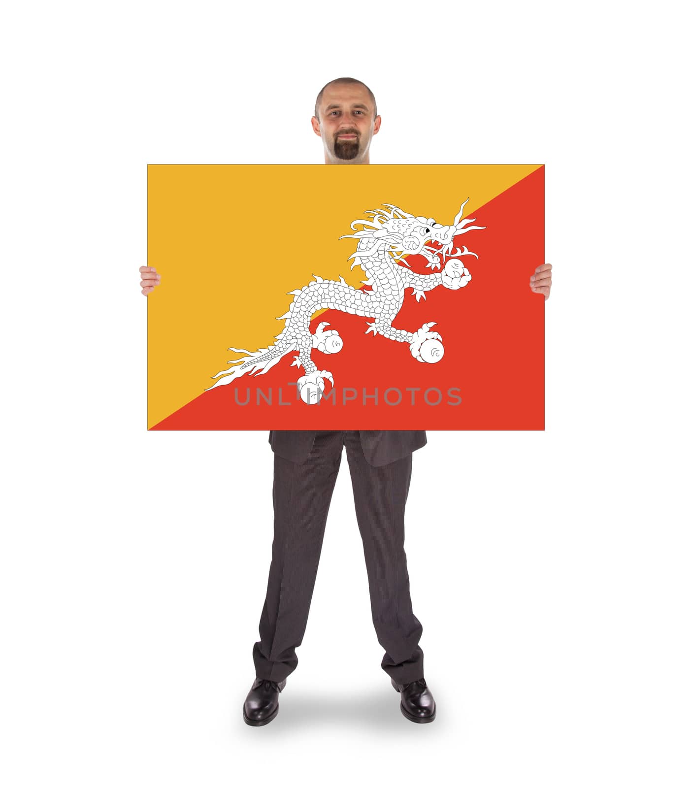 Smiling businessman holding a big card, flag of Bhutan