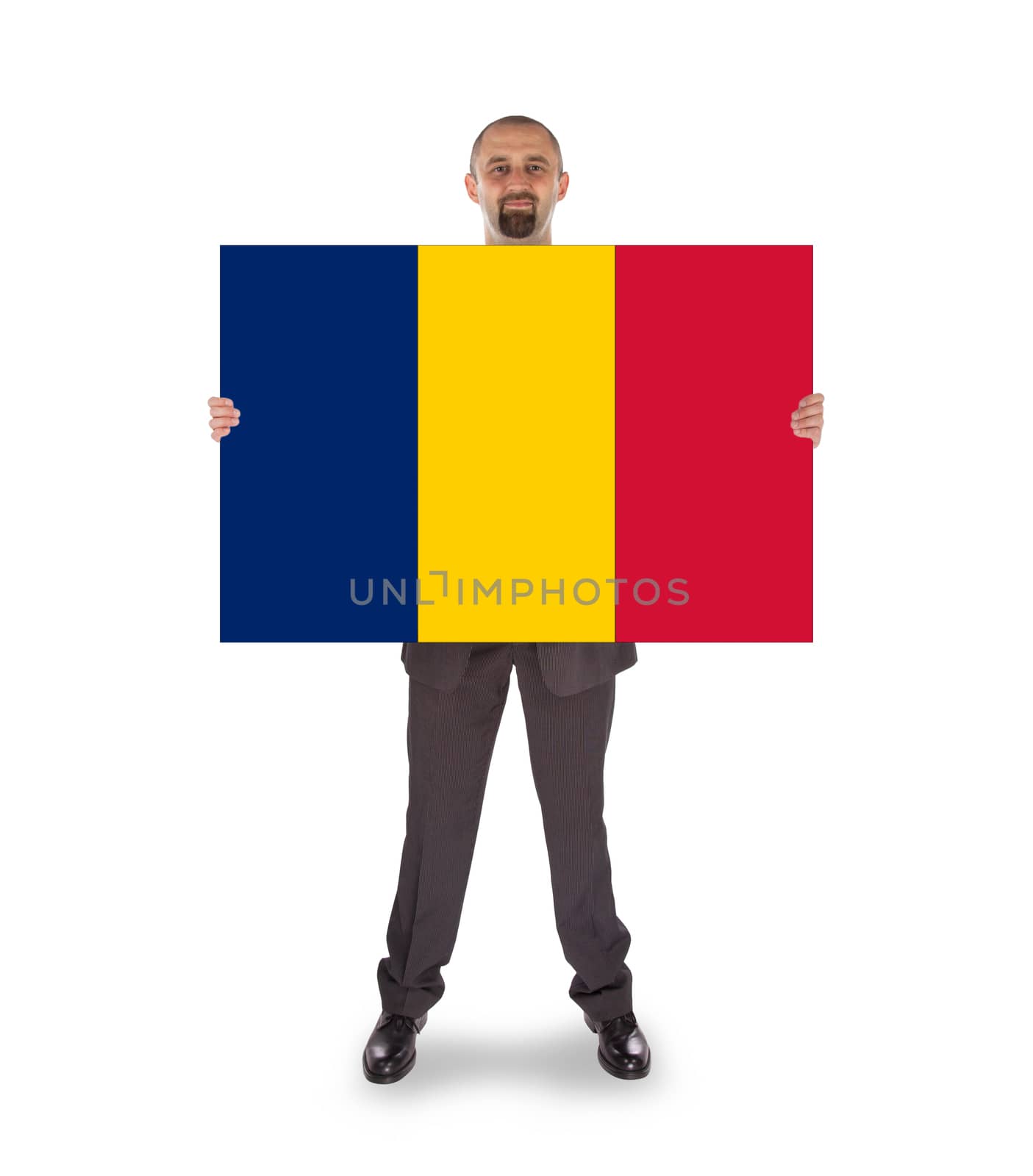 Smiling businessman holding a big card or flag by michaklootwijk