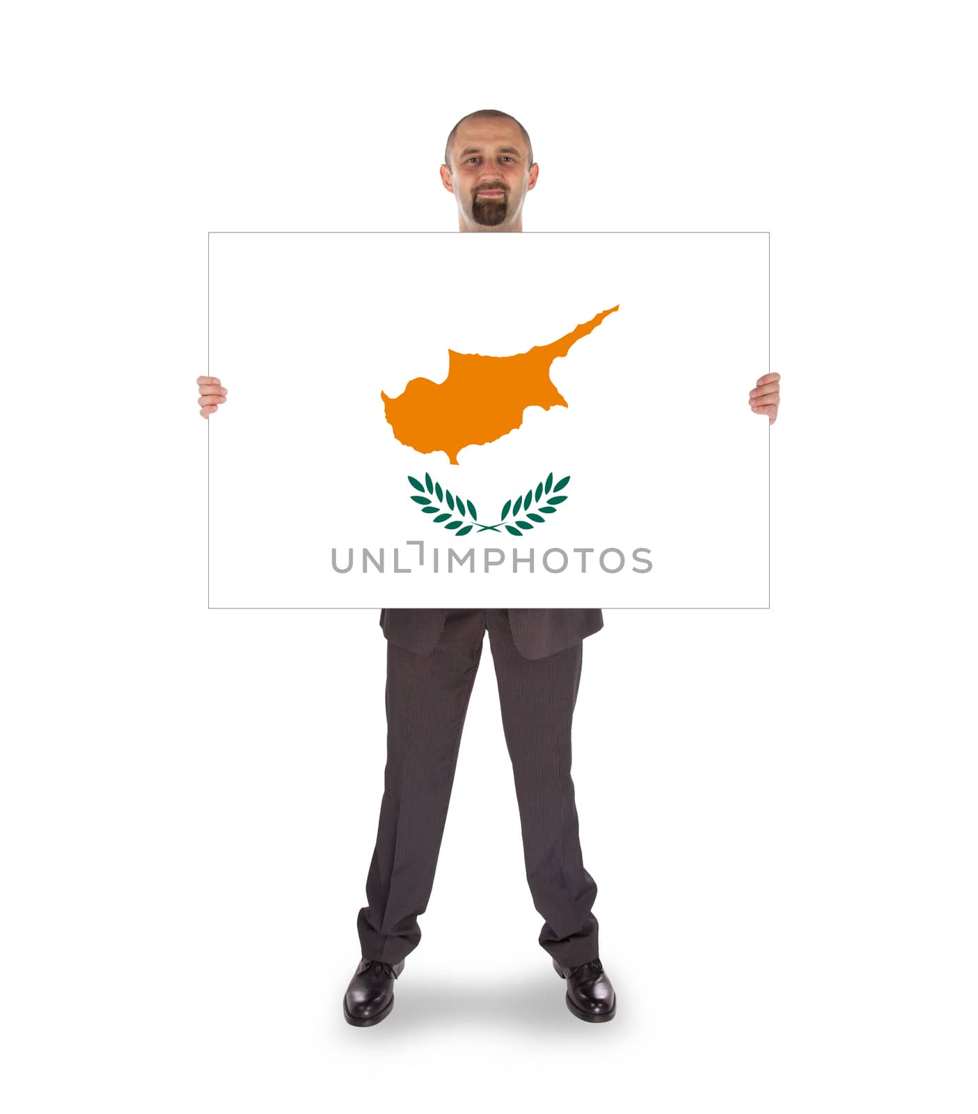 Smiling businessman holding a big card, flag of Cyprus