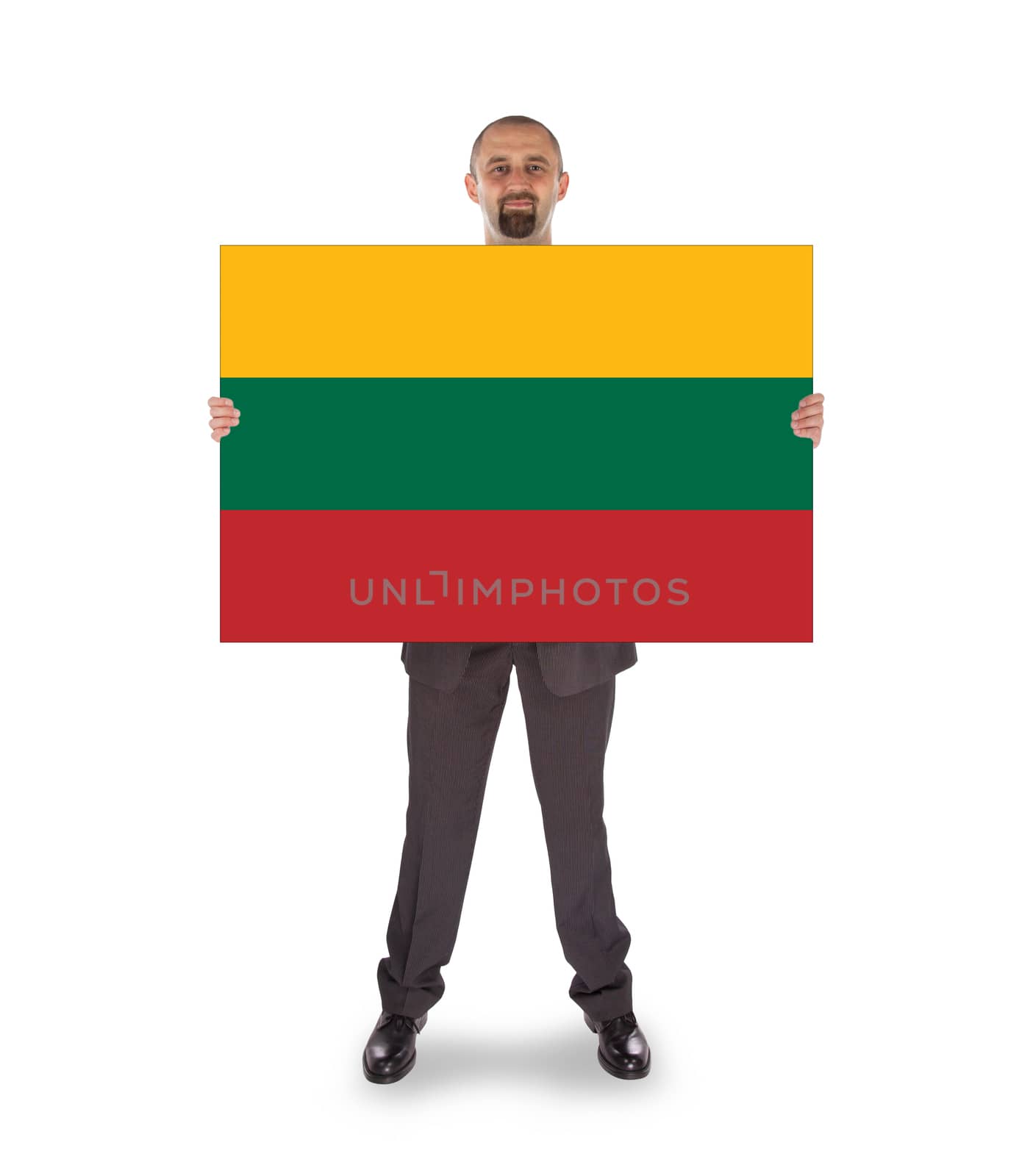 Smiling businessman holding a big card, flag of Lithuania