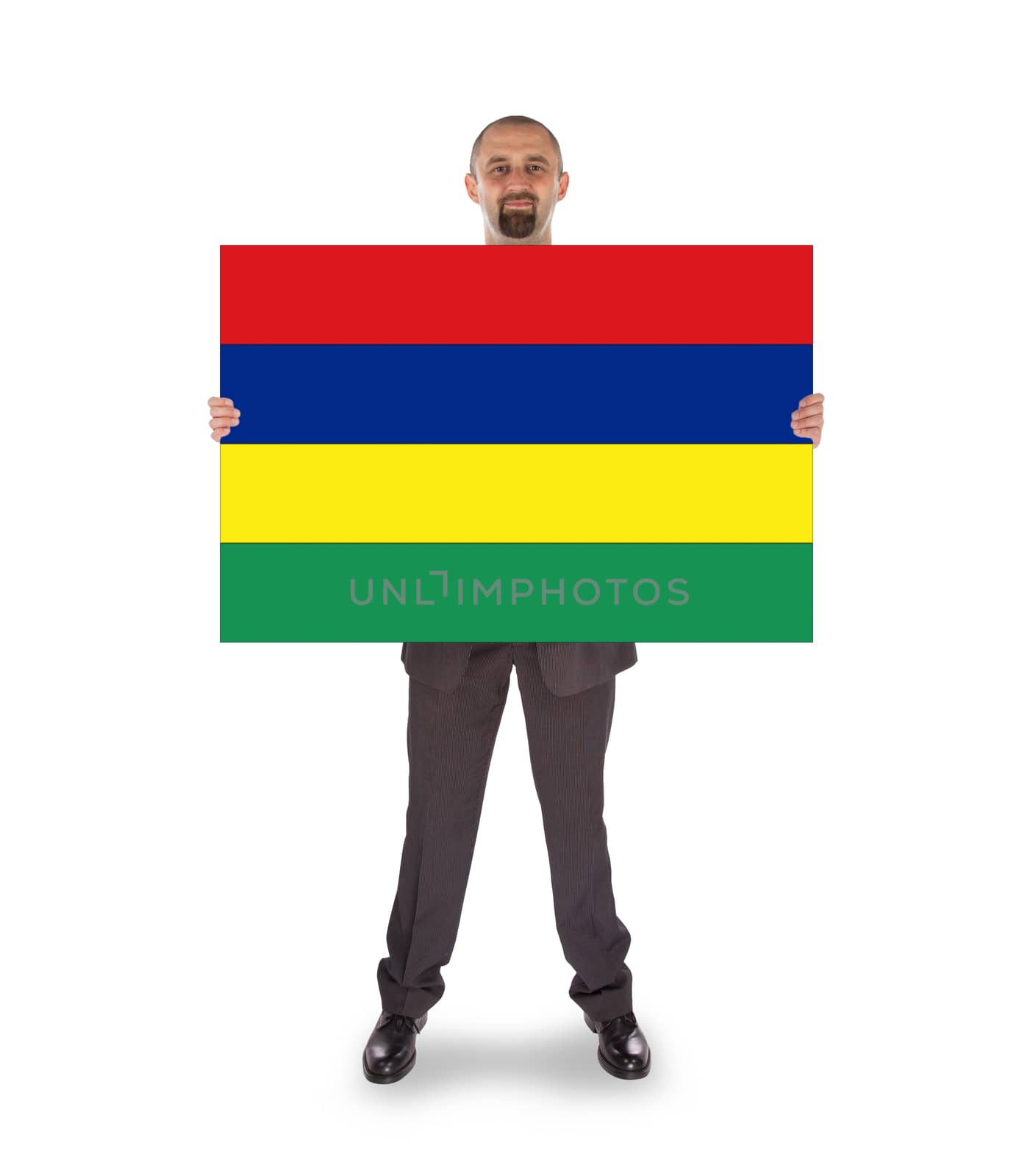 Smiling businessman holding a big card, flag of Mauritius
