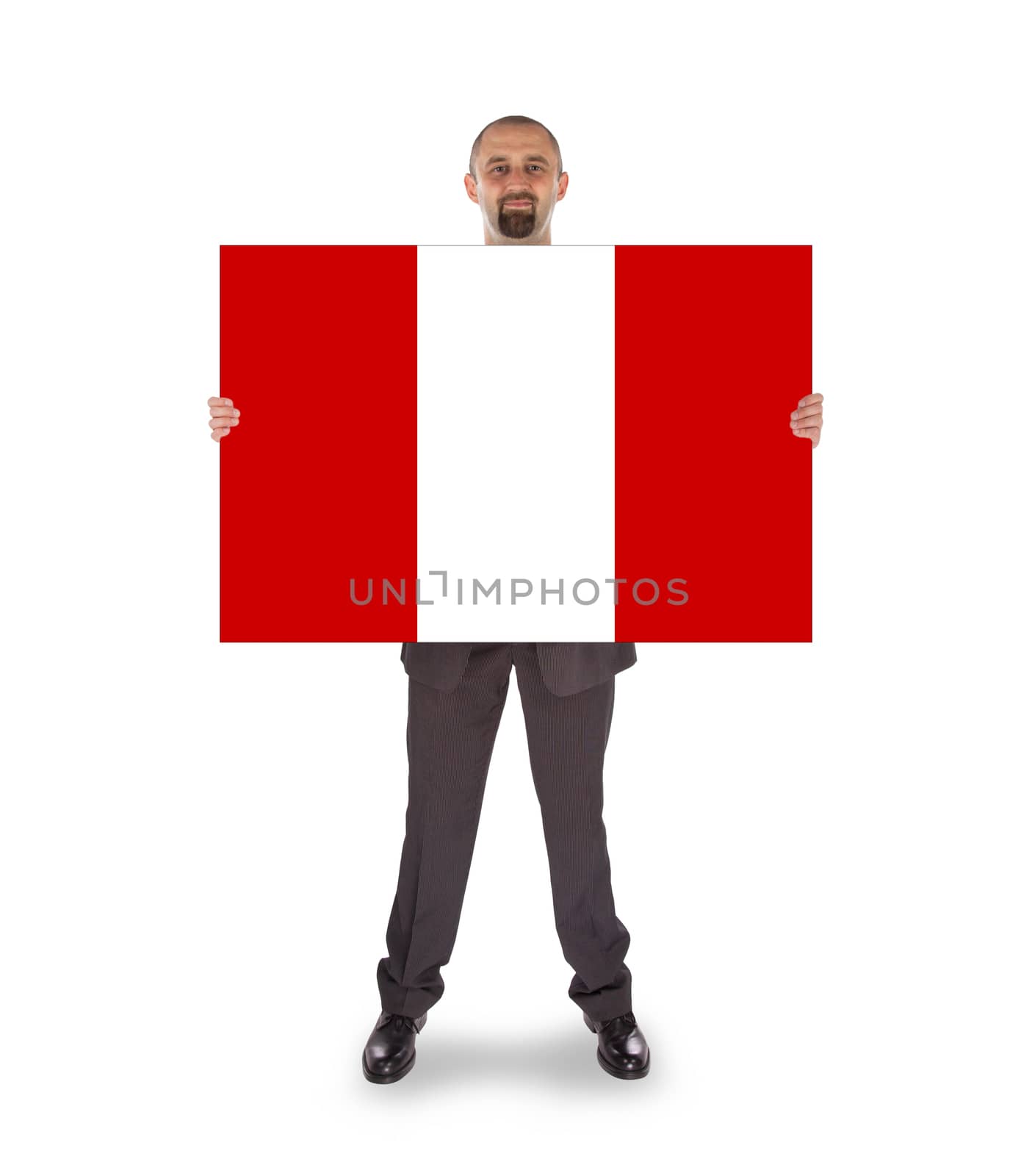 Smiling businessman holding a big card, flag of Peru