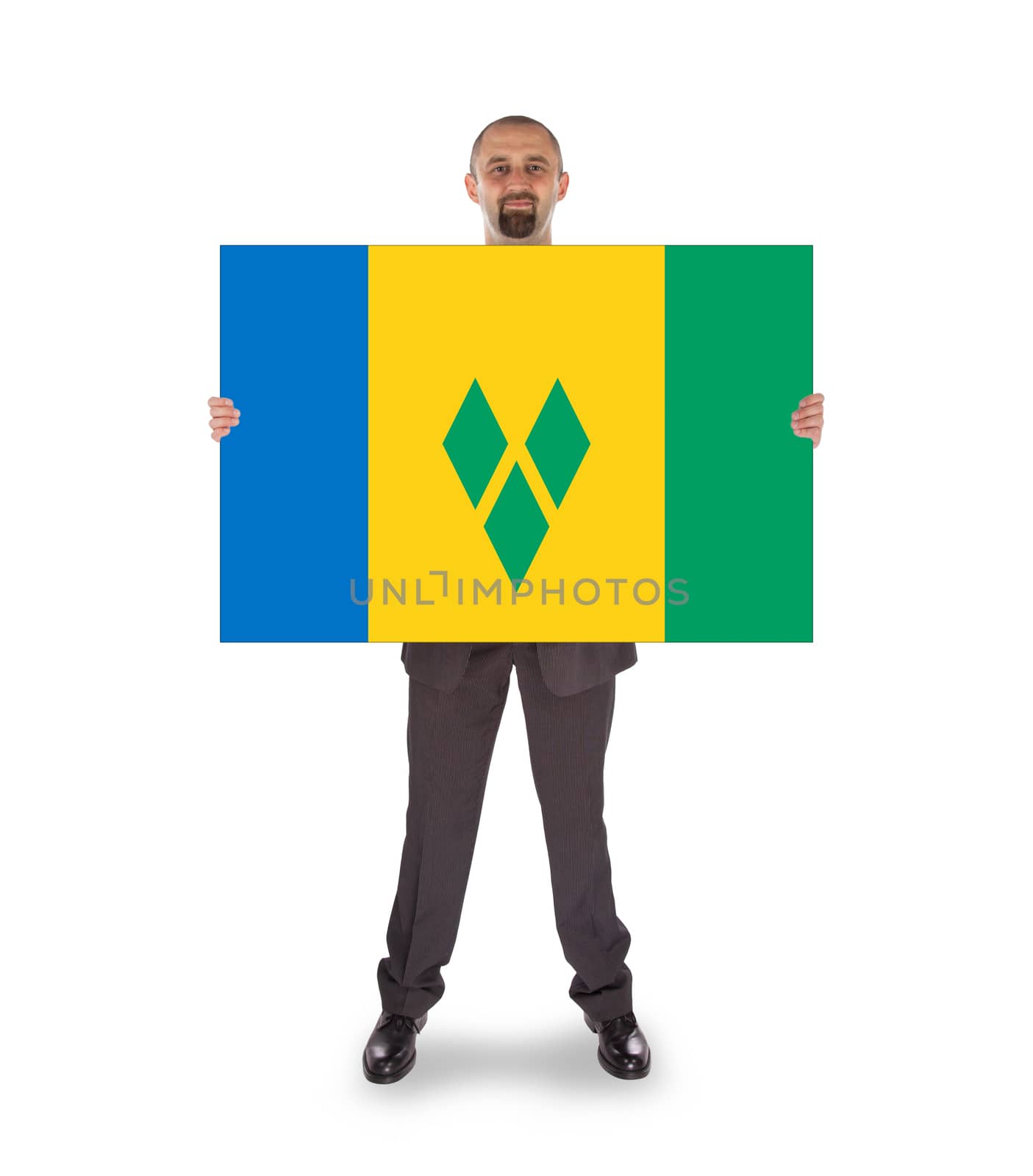 Smiling businessman holding a big card, flag of Saint Vincent and the Grenadines