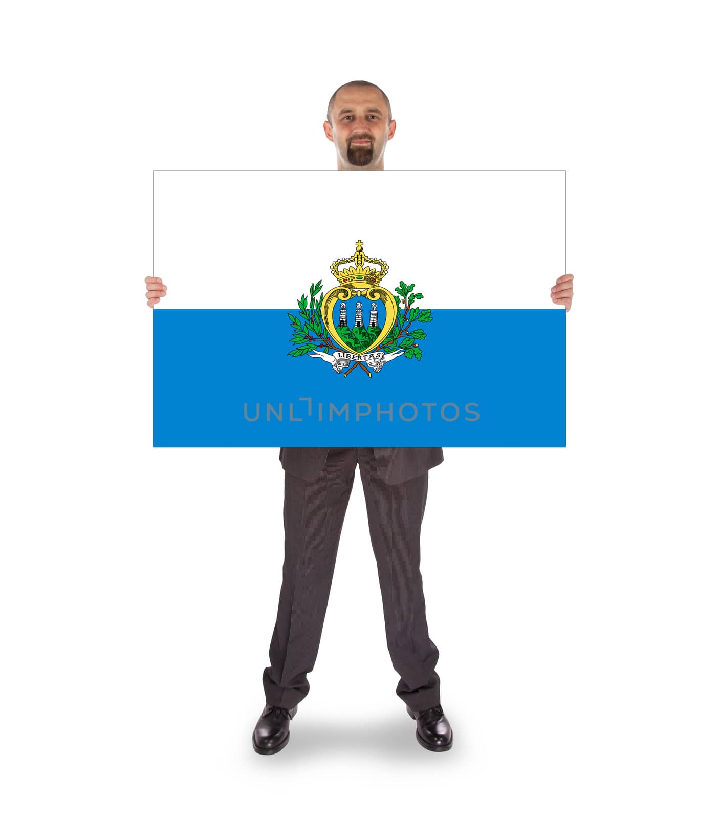 Smiling businessman holding a big card, flag of San Marino