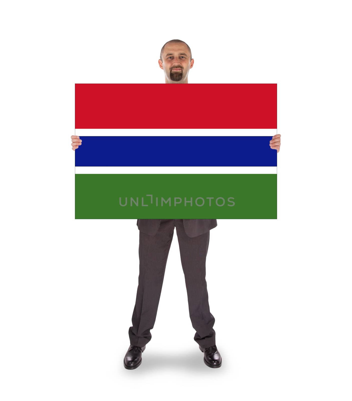 Smiling businessman holding a big card, flag of The Gambia