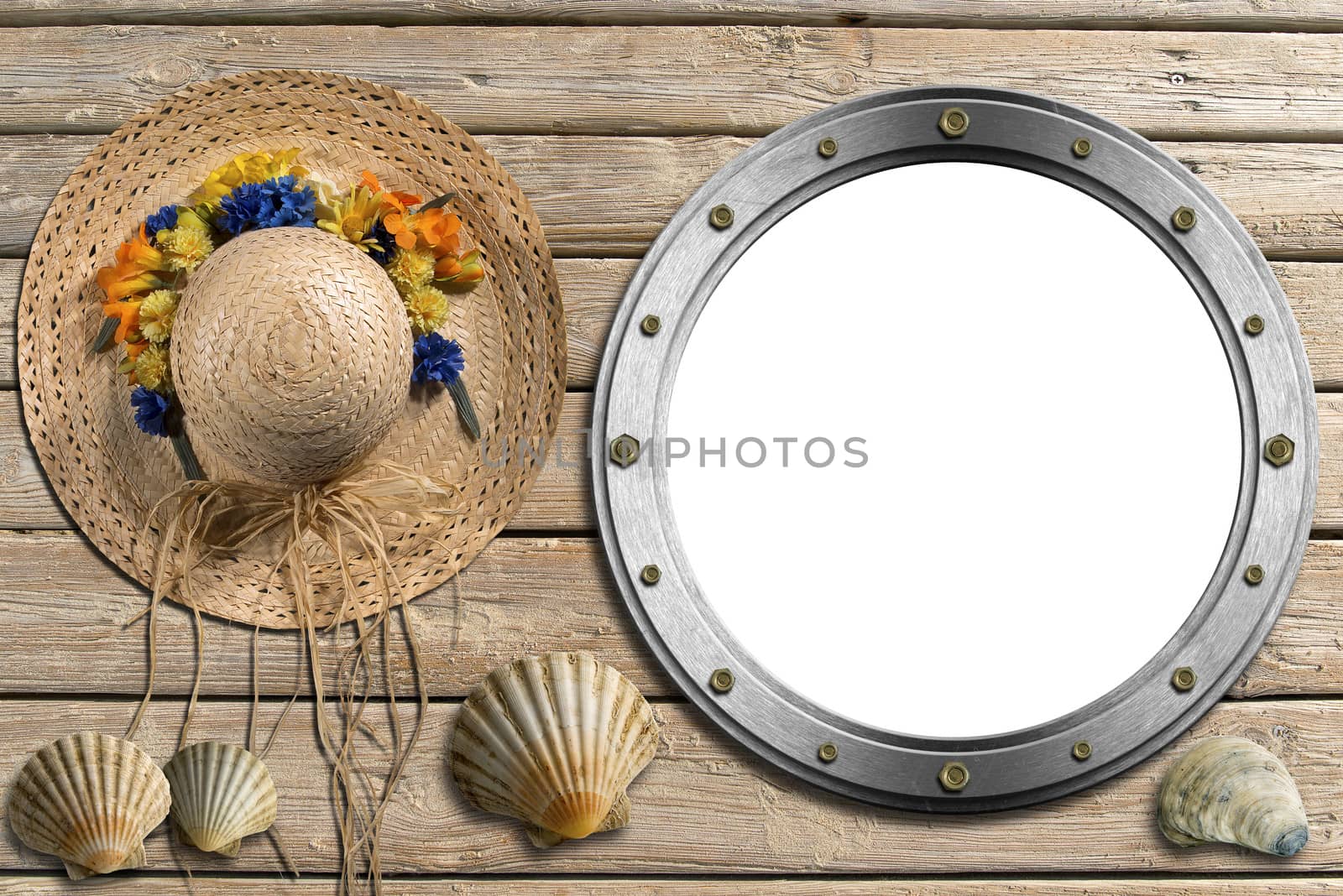 Metal empty porthole with seashells and straw hat with flowers on wooden floor with sand