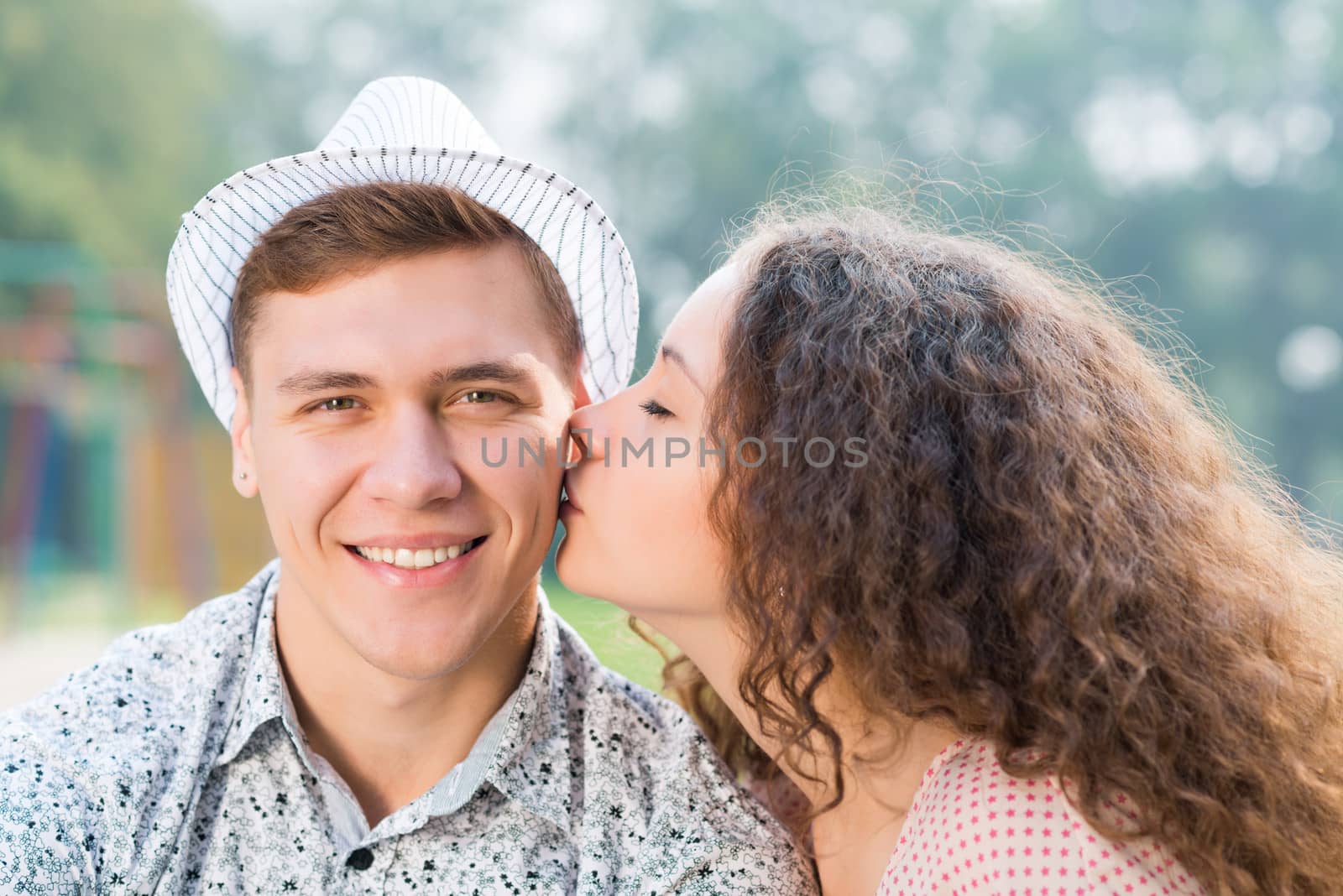 girl kissing a man on the cheek, spending time with loved ones