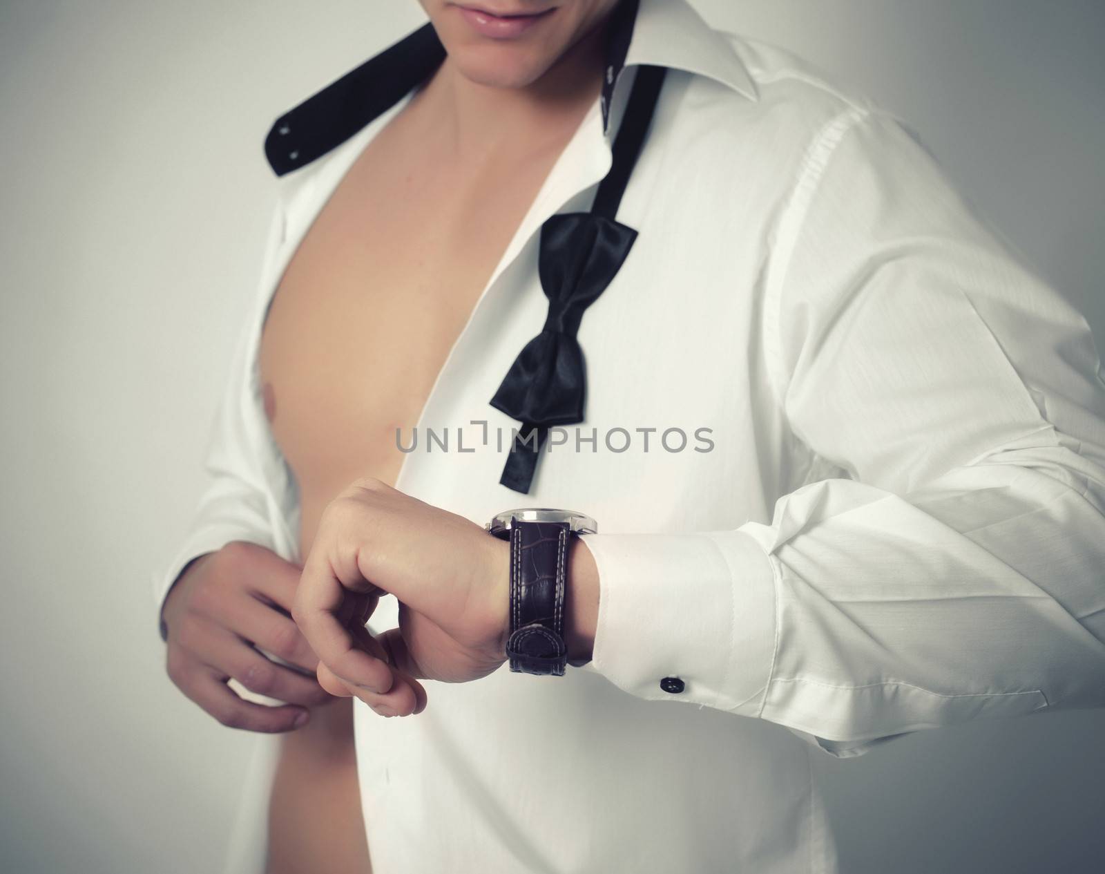 Businessman checking the time on his wristwatch