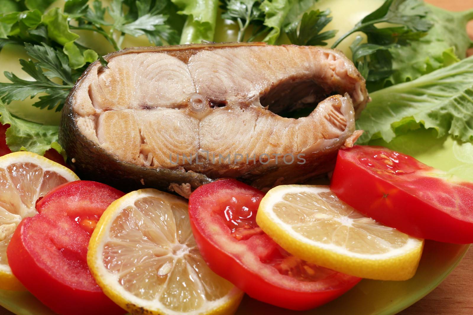 salmon with green salad tomatoes and lemon by goce