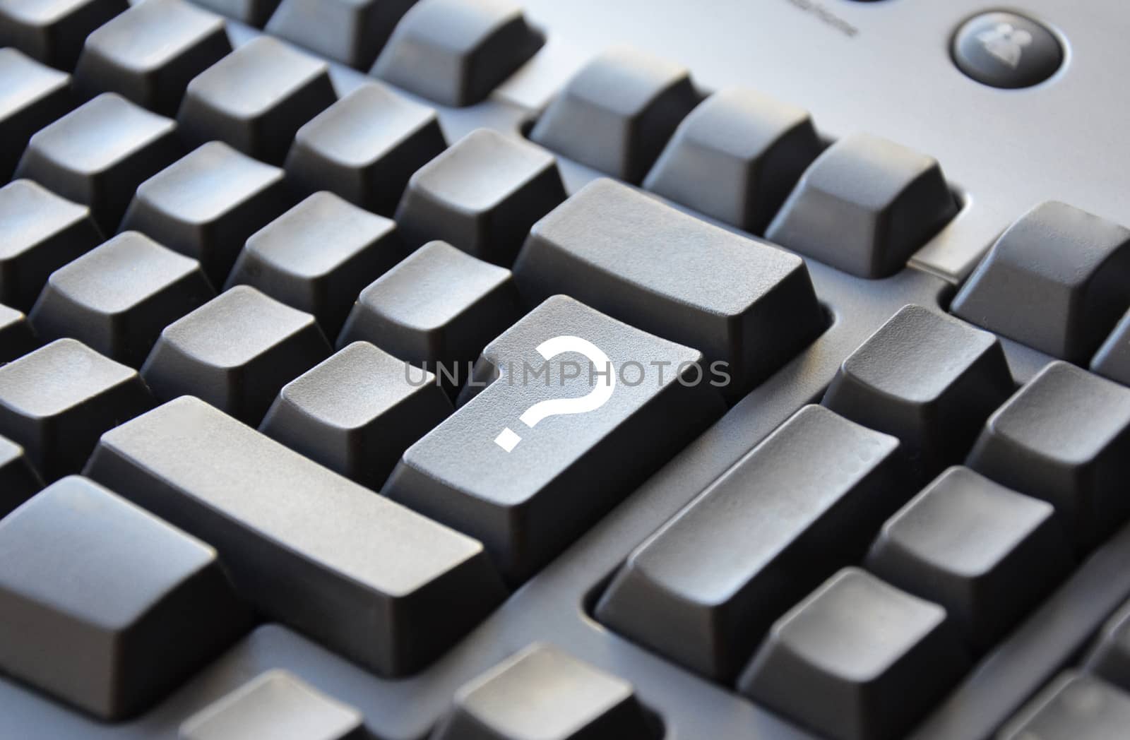White question mark on grey keyboard by alentejano