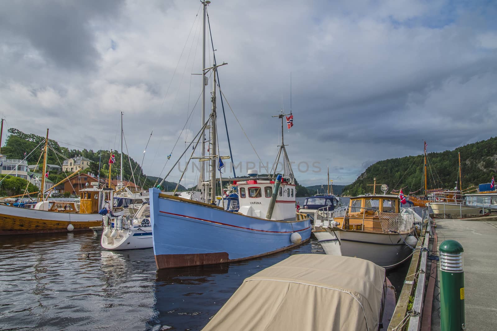 The boats are on show at the harbor during Halden food and harbor festival which is held every year on the last weekend of June. There are both wooden boats and fiberglass boats and large and small boats.