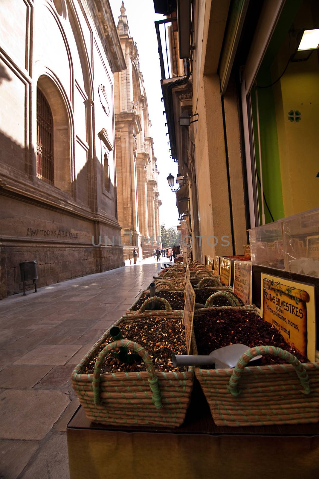 Market spices at the foot of the Tower of the Cathedral of Granada, Spain