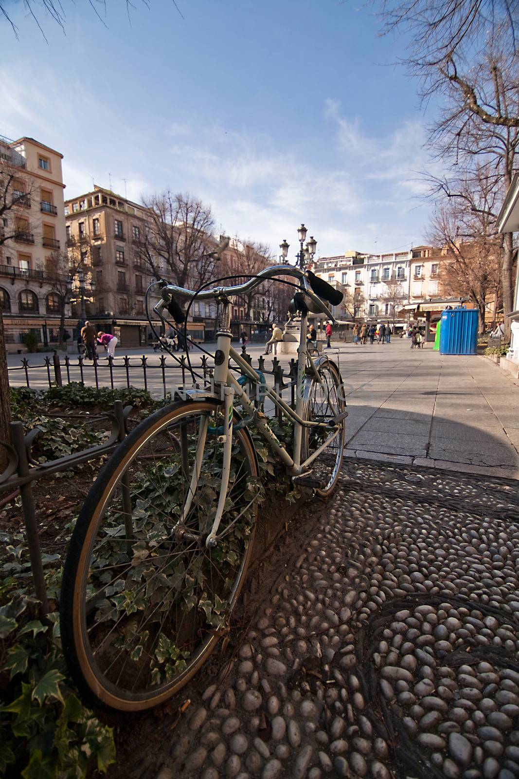 Solitary bicycle parked at bibarrambla square, In moorish times, fair and festivals were celebrated here, and then in the times of the Christians had bullfights. Granada, Spain
