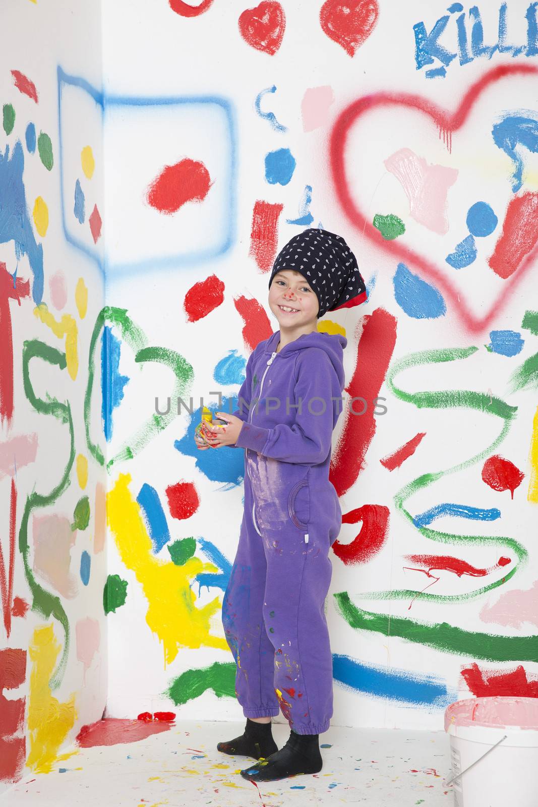 Young Painting Girl in a room