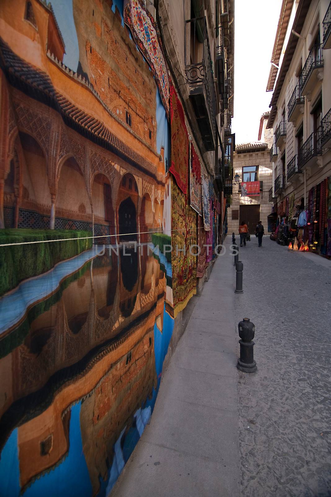 Fabrics and tapestries hanging on a wall near to Carrera del Darro, Granada, Spain