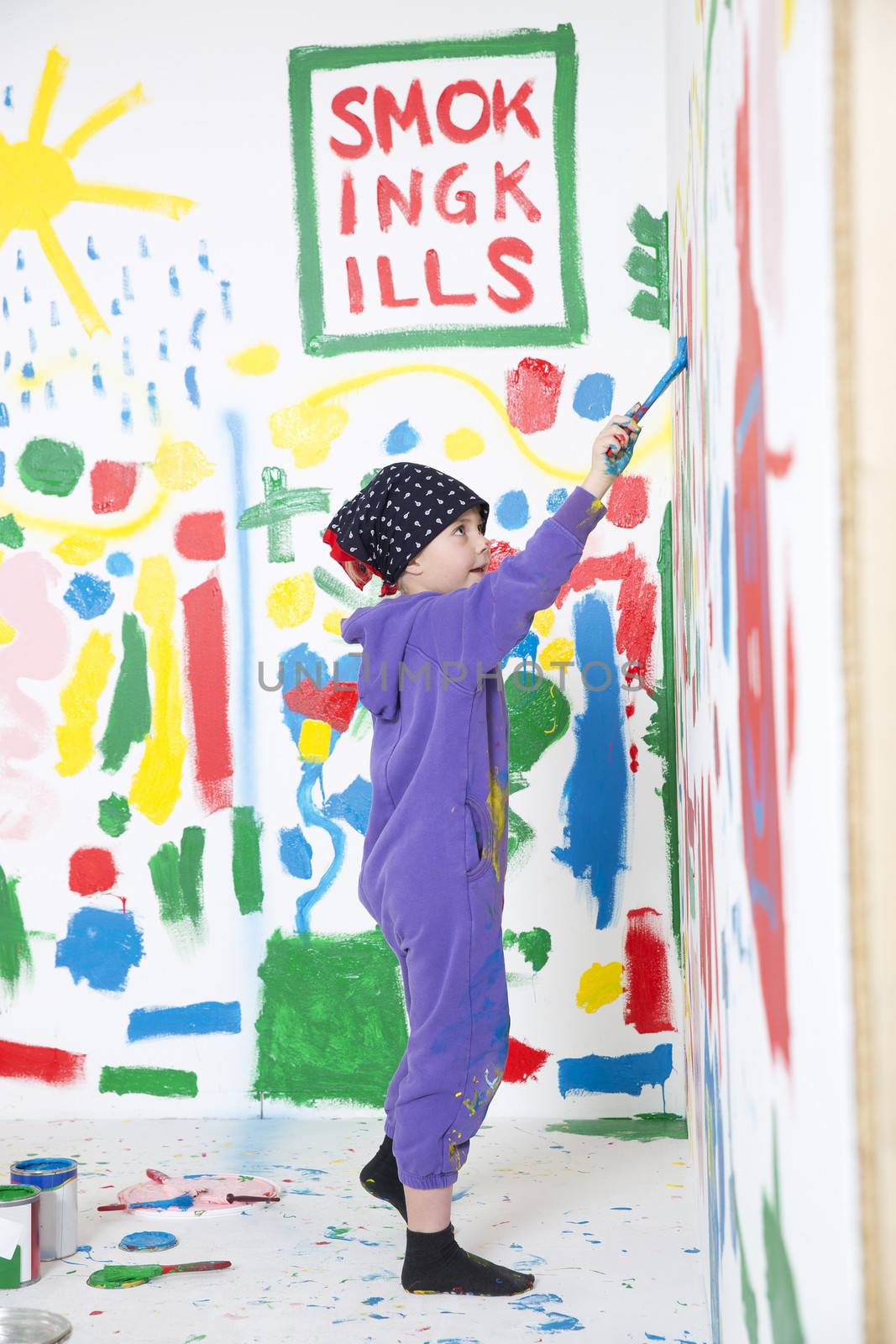 Young Painting Girl in a room