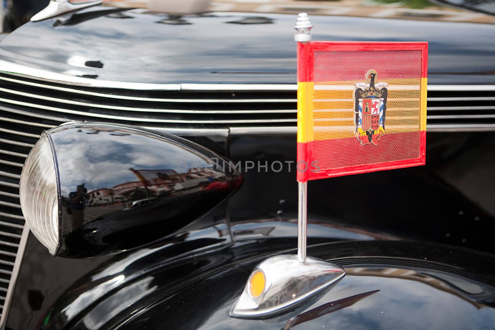 Francoist flag on vintage car, Spain by digicomphoto