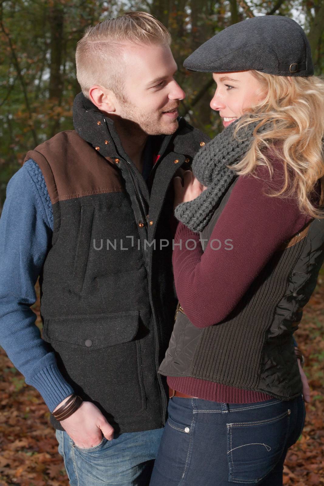 Happy young couple is having a nice time in october