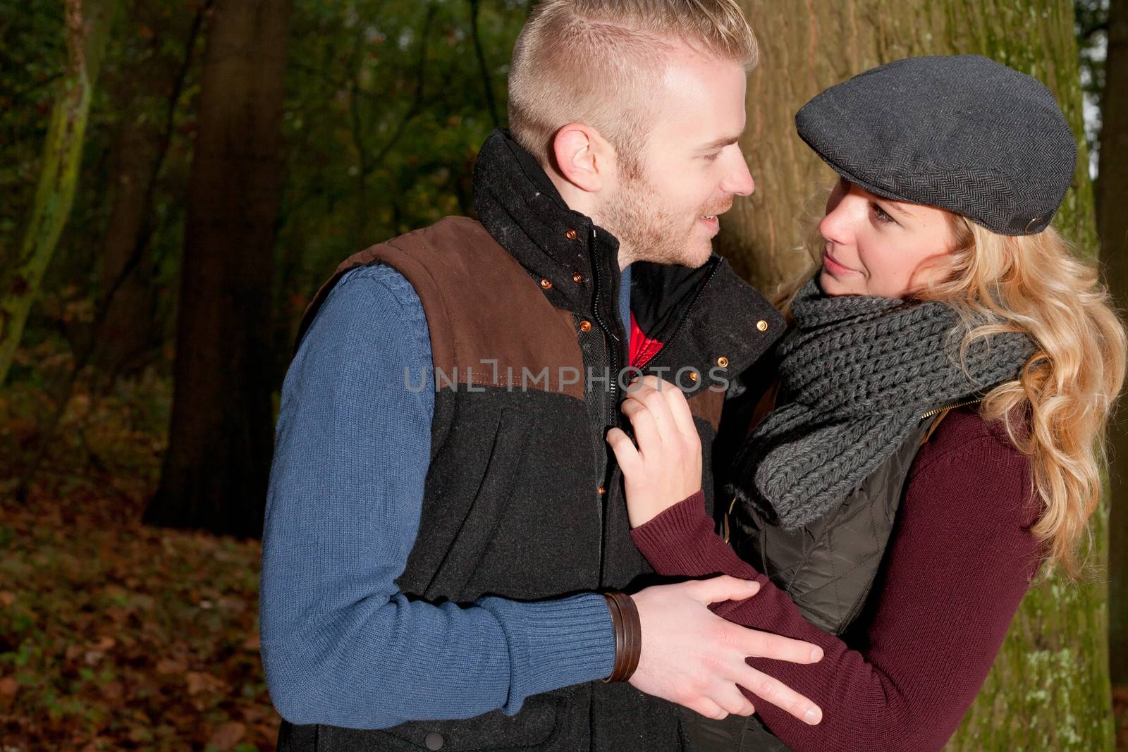 Happy young couple is having a nice time in october