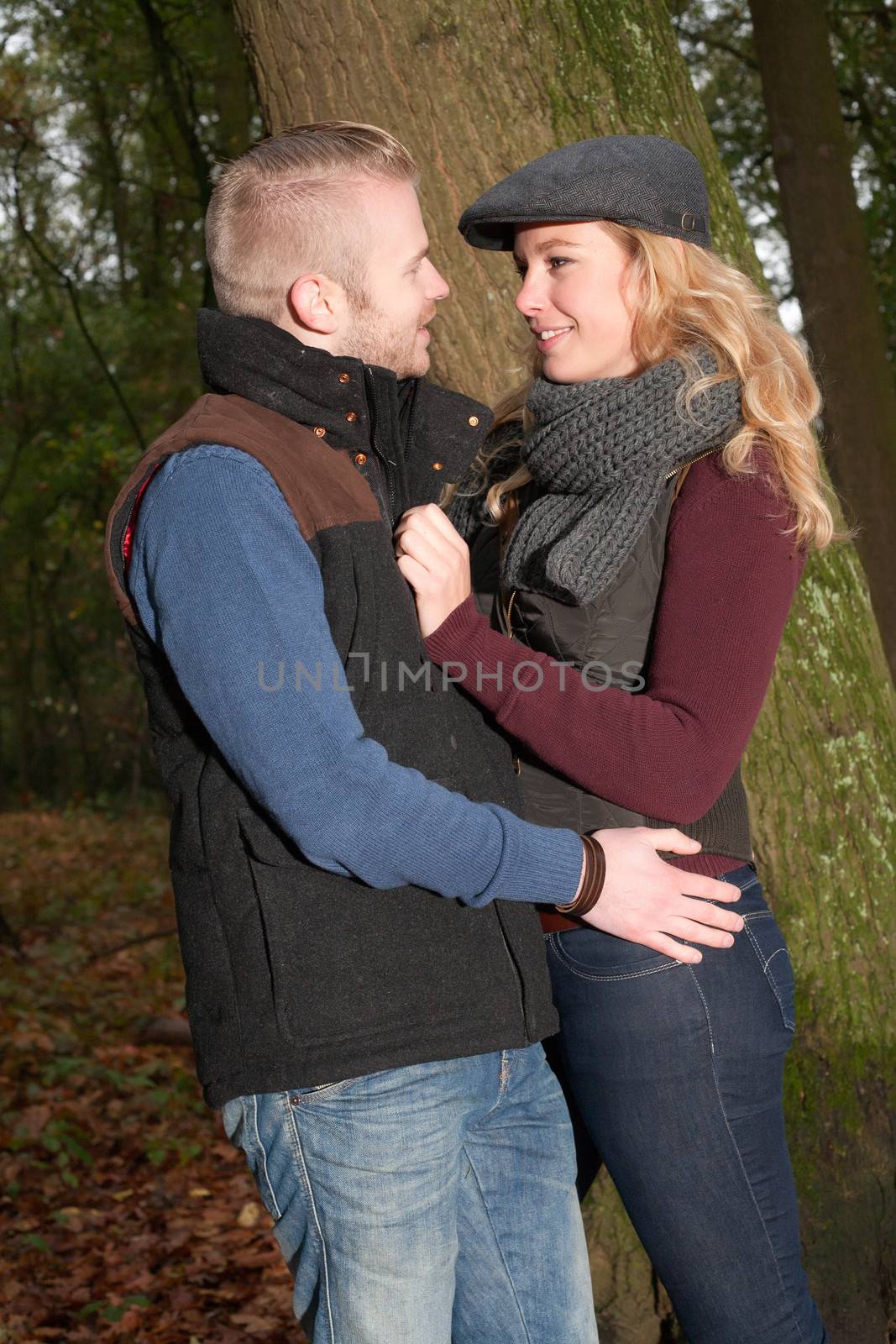 Happy young couple is having a nice time in october