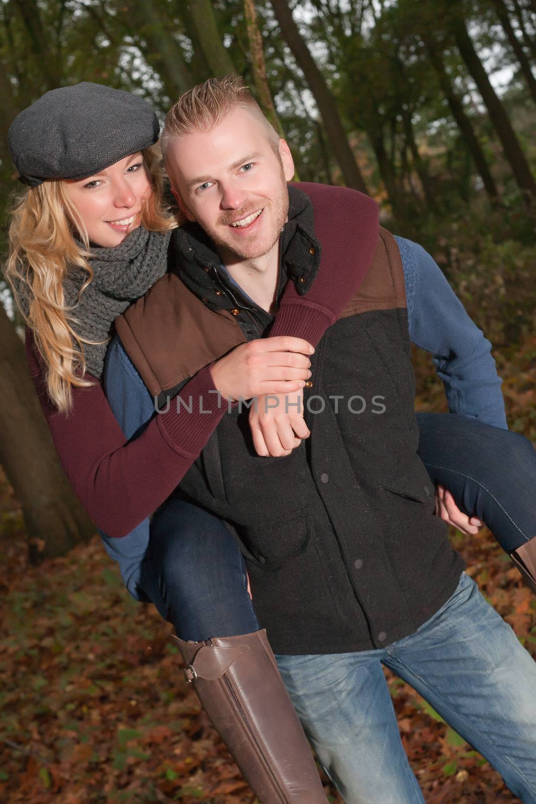 Happy young couple is having a nice time in october