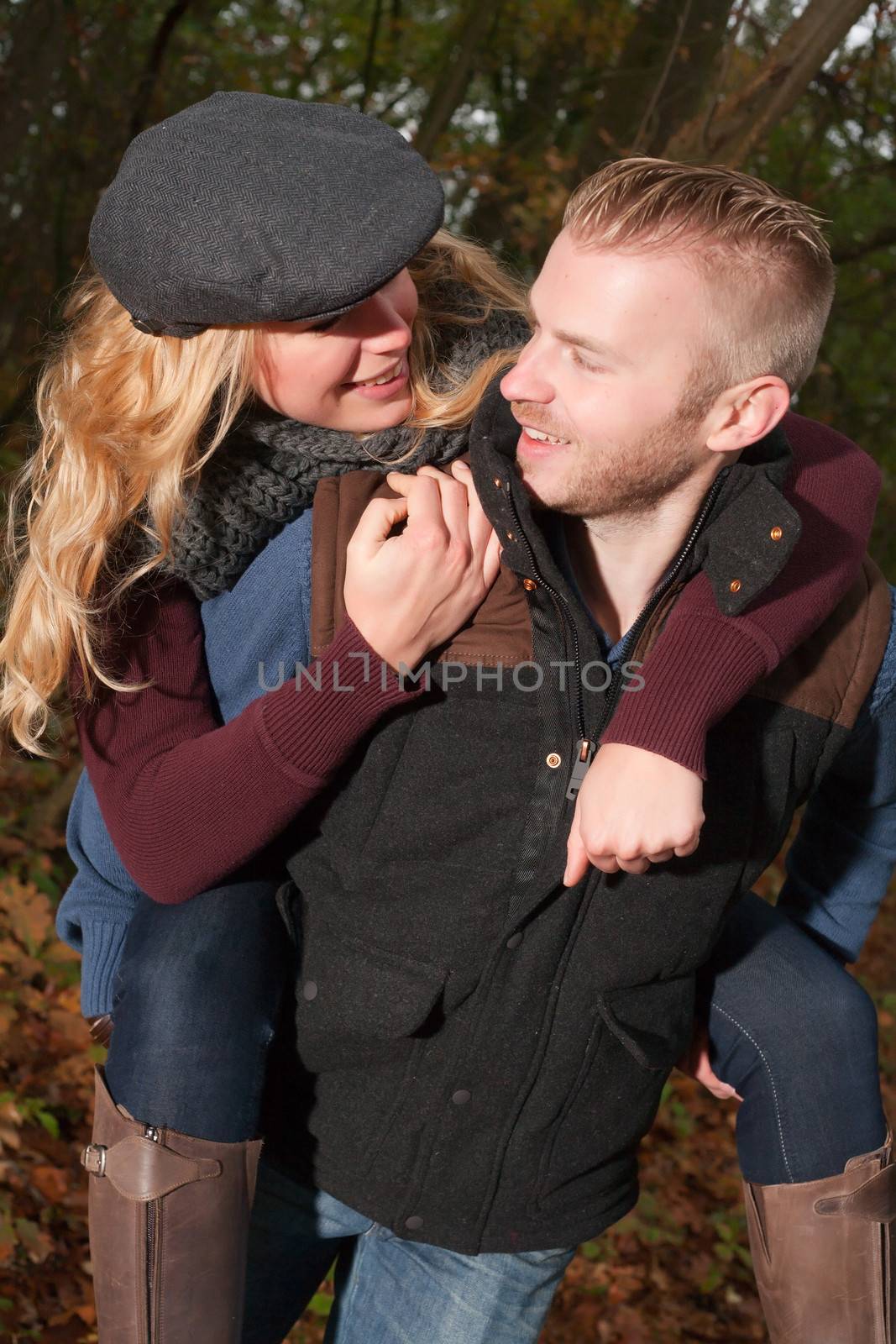 Happy young couple is having a nice time in october