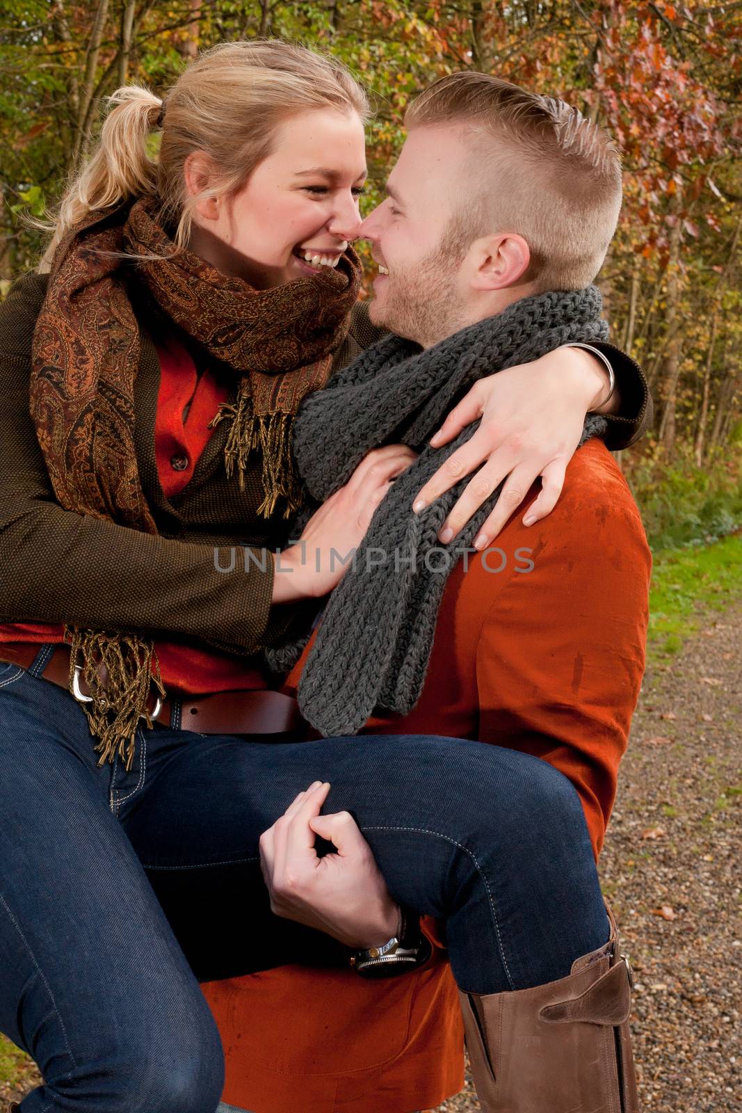 Happy young couple is having a nice time in october