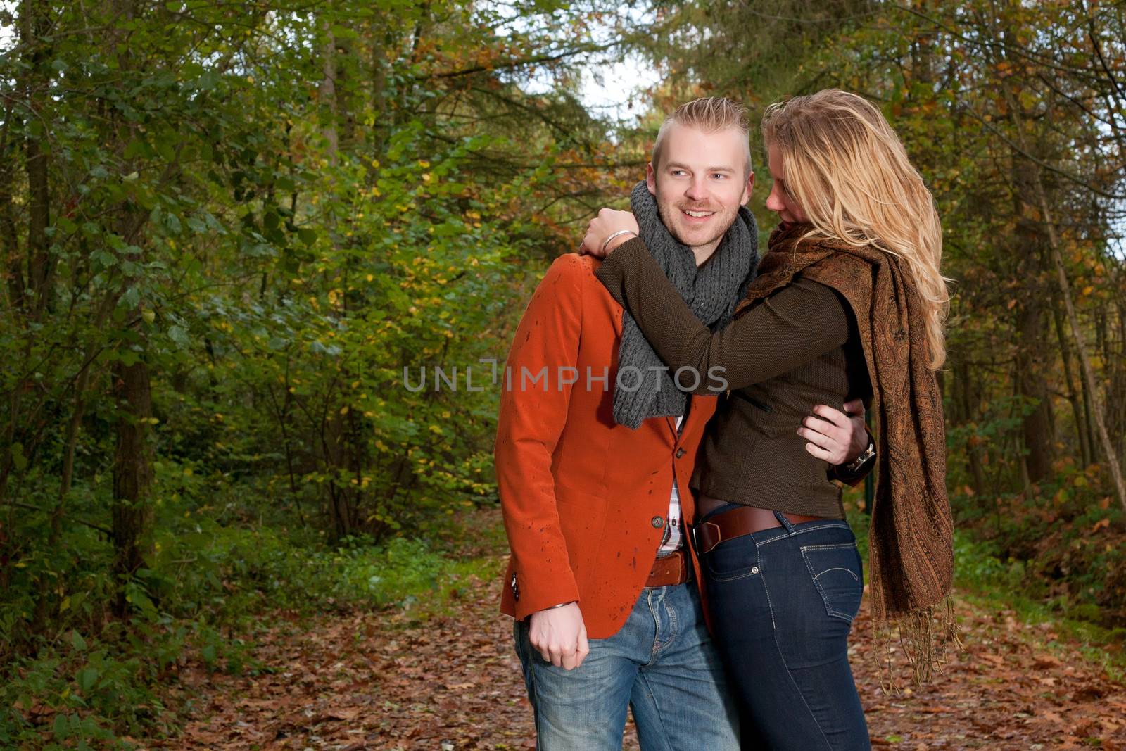 Happy young couple is having a nice time in october